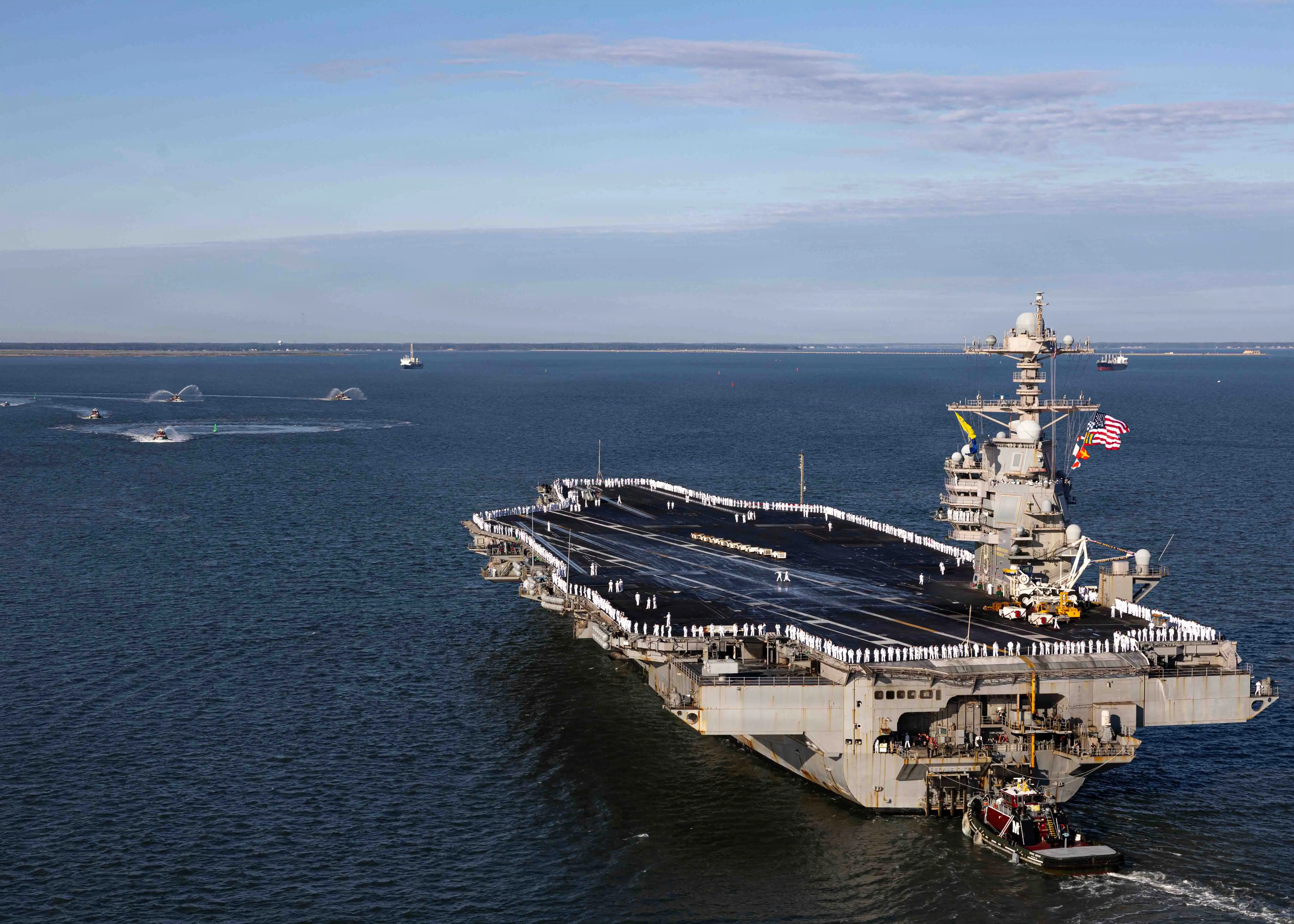 The USS Gerald R. Ford sails in dark blue water.