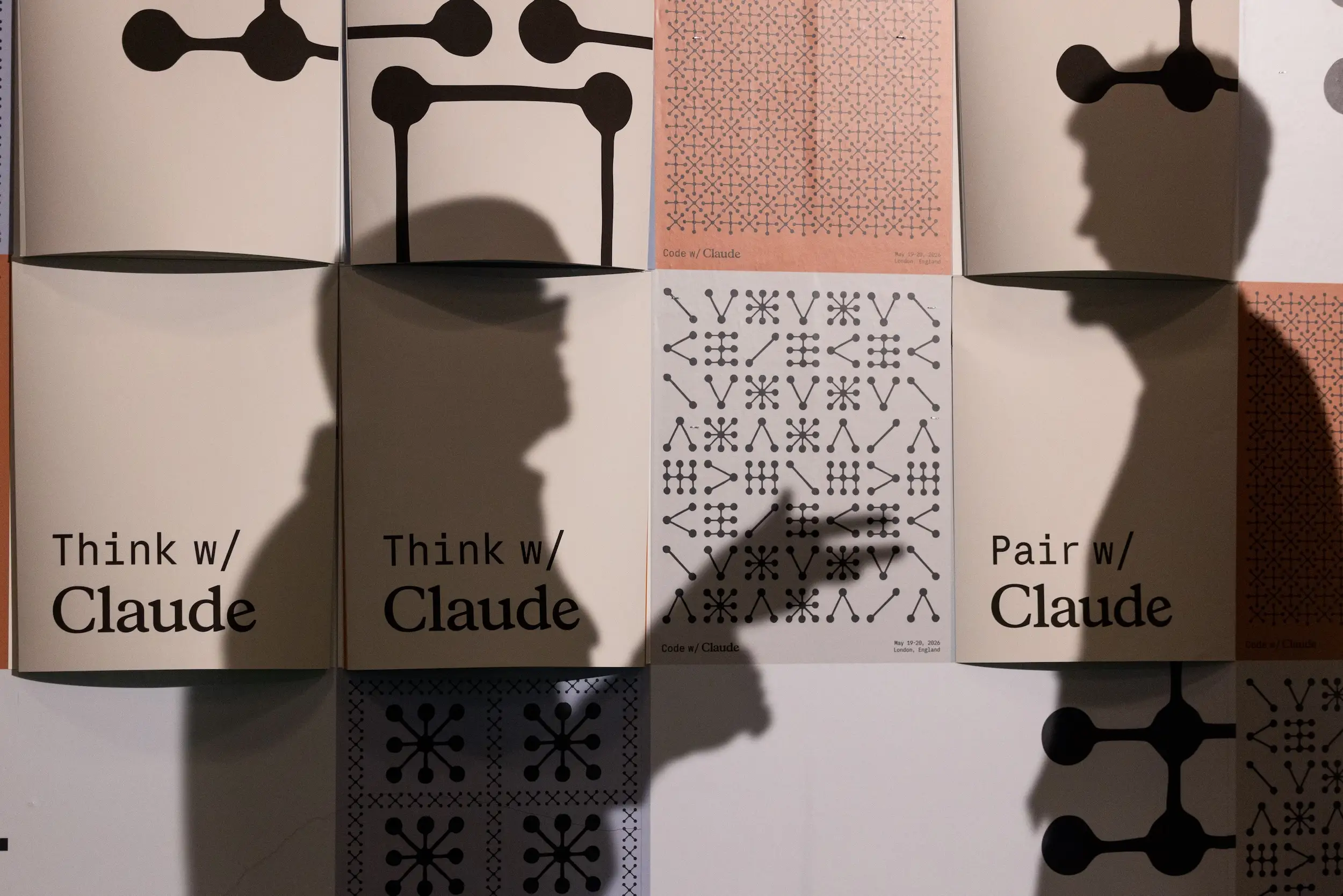 Claude Code posters are seen during an Anthropic conference