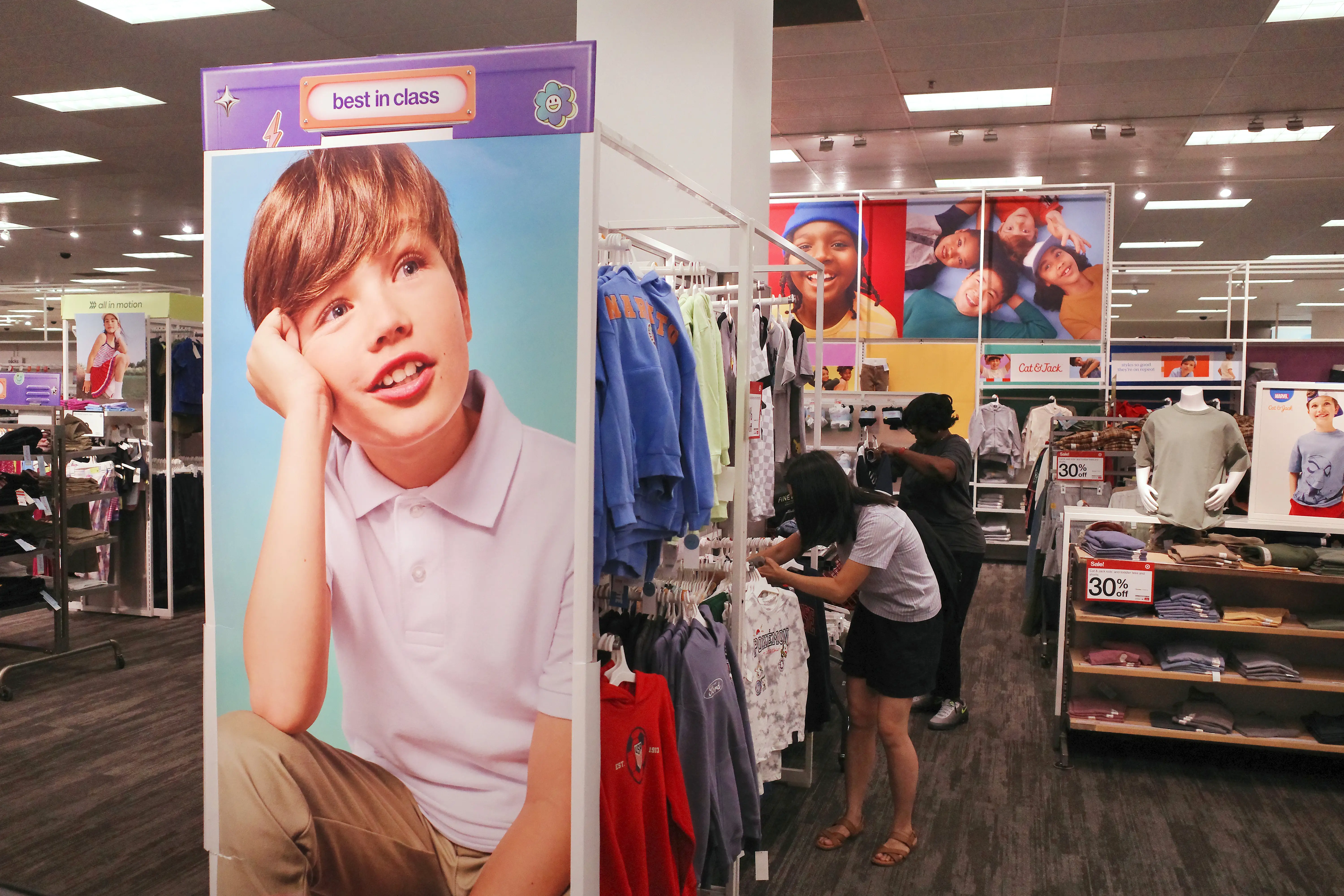 People look at back to school clothes at a Target store on August 13, 2026 in Downtown Brooklyn in New York City.