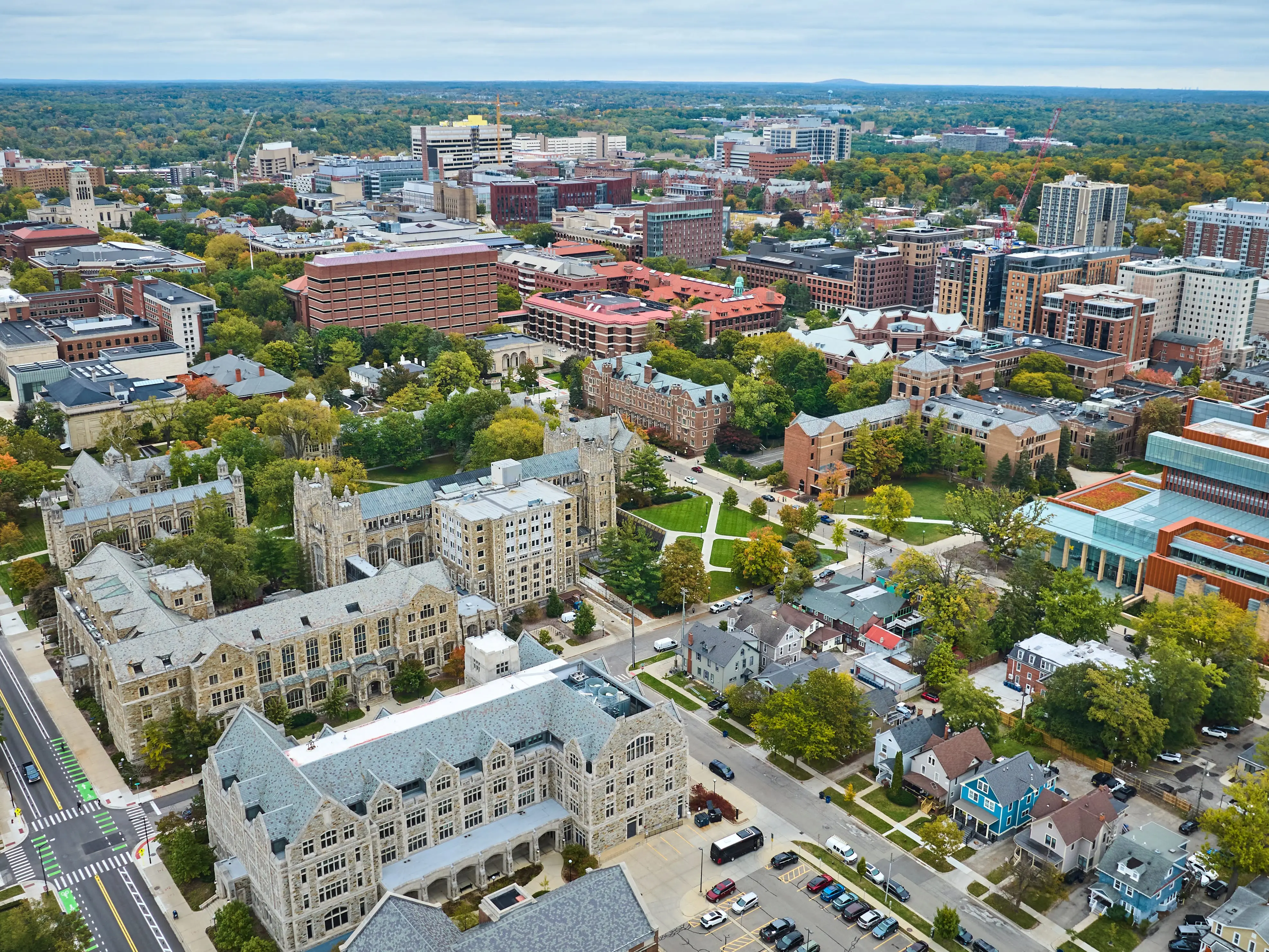 Aerial view of the diverse architecture of Downtown Ann Arbor, capturing the University of Michigan campus in vibrant autumn hues.