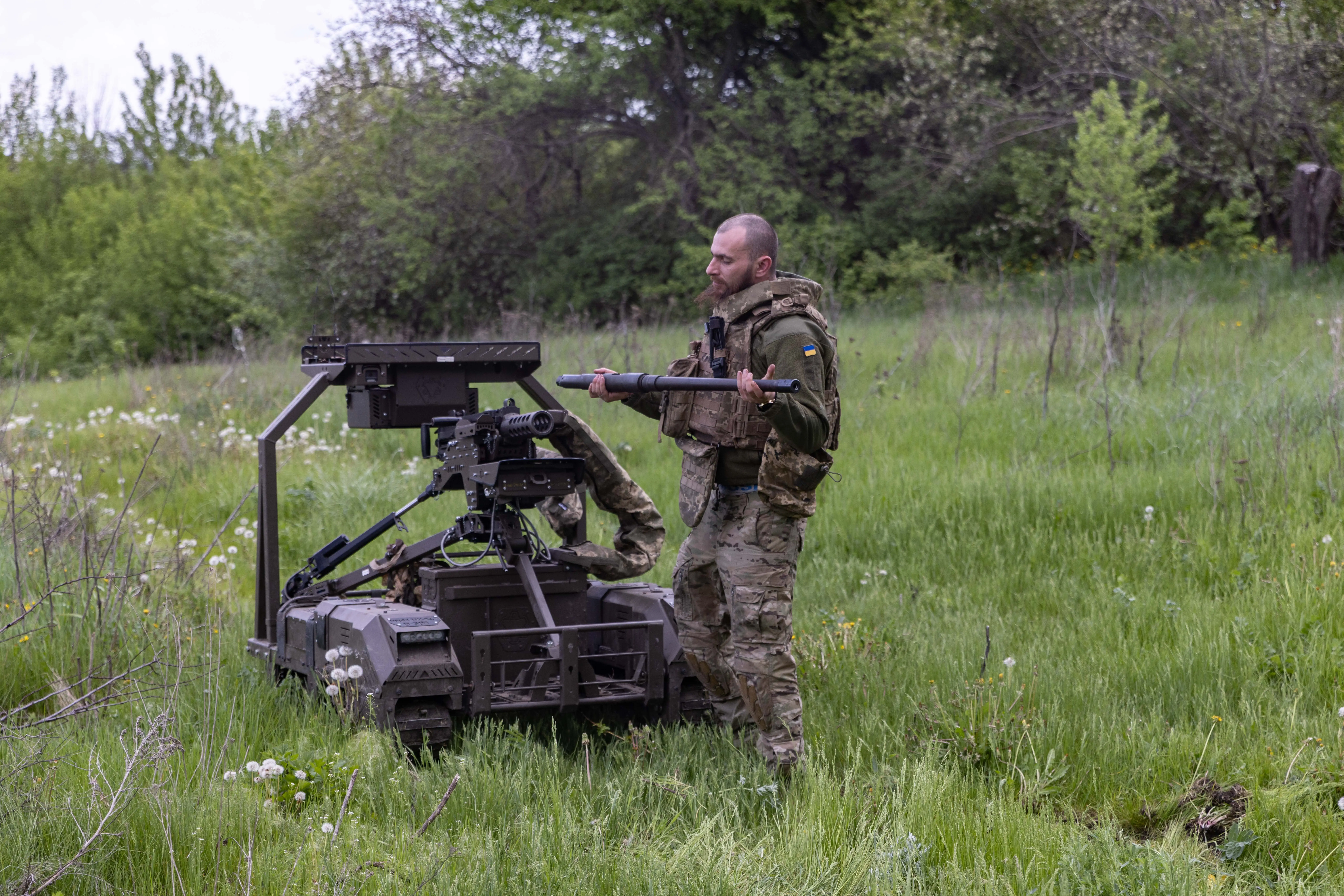 Servicemembers of the Unmanned Ground Systems unit of Ukraine's 14th Separate Mechanized Brigade 'Chervona Kalyna' prepare ground robots for use on May 12, 2026, in Kharkiv Oblast, Ukraine.