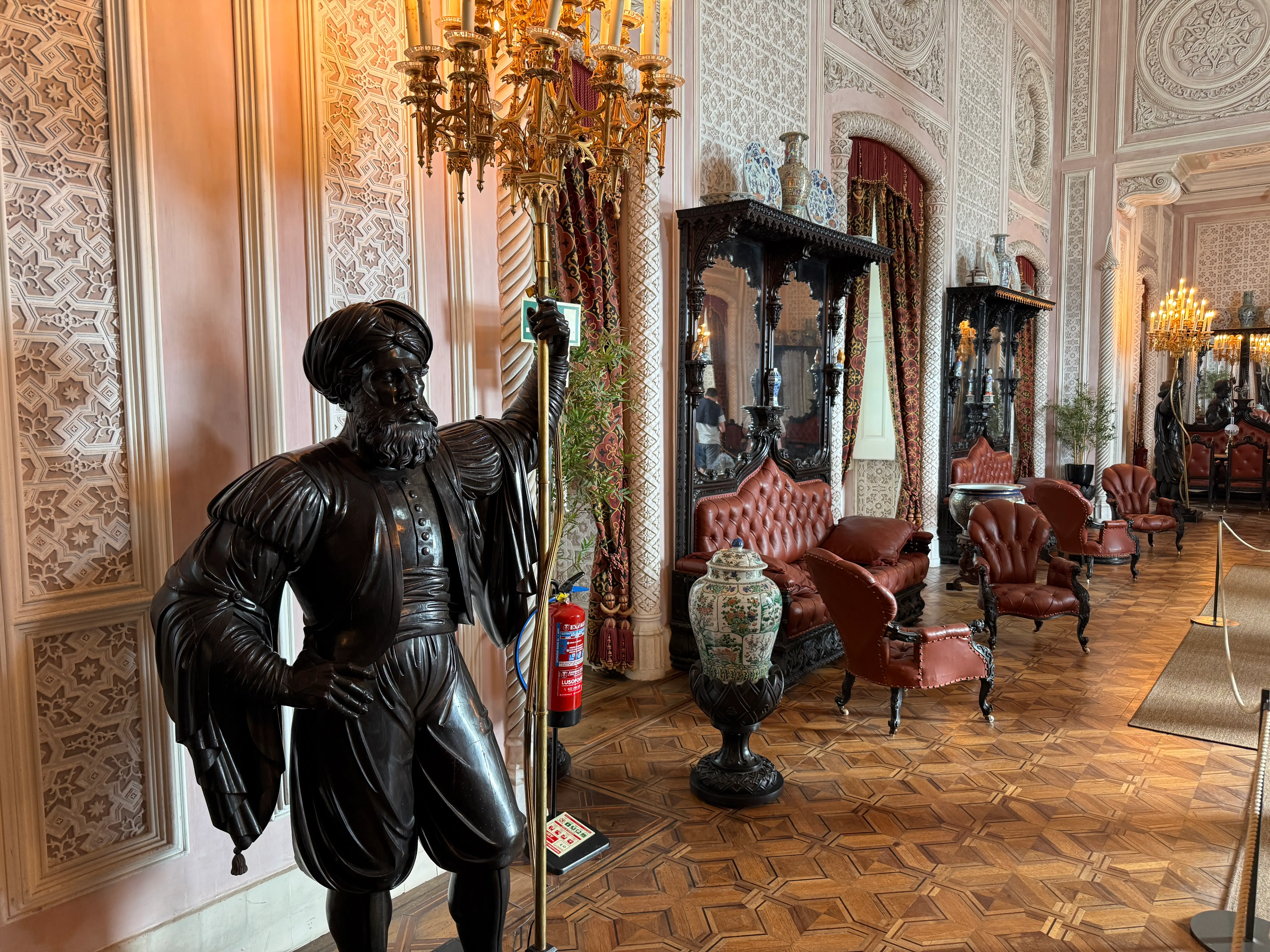 Interior of Pena Palace with statues, chandelier