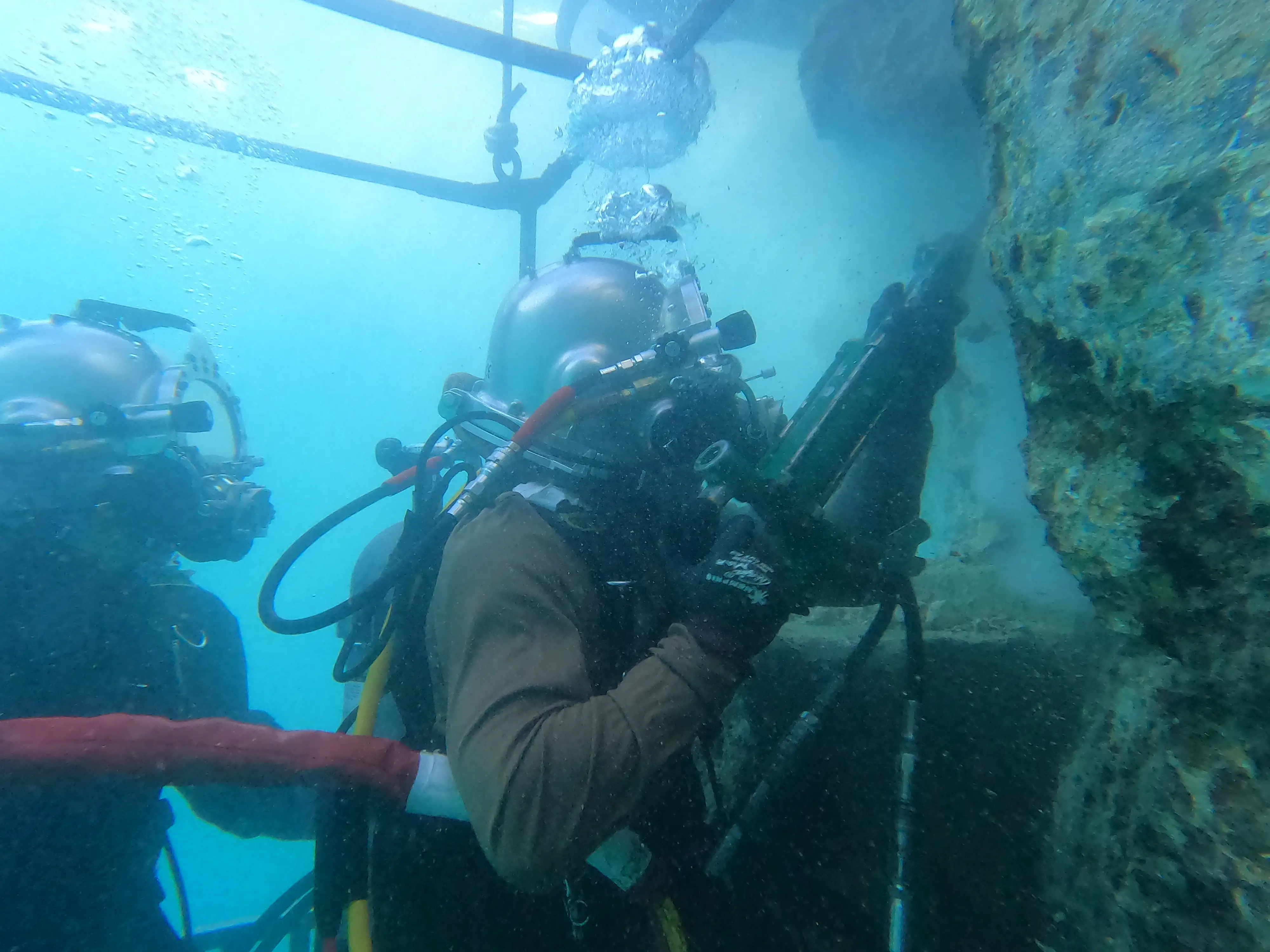 US Navy sailors repair damaged port walls at Palau during a training event in 2024.