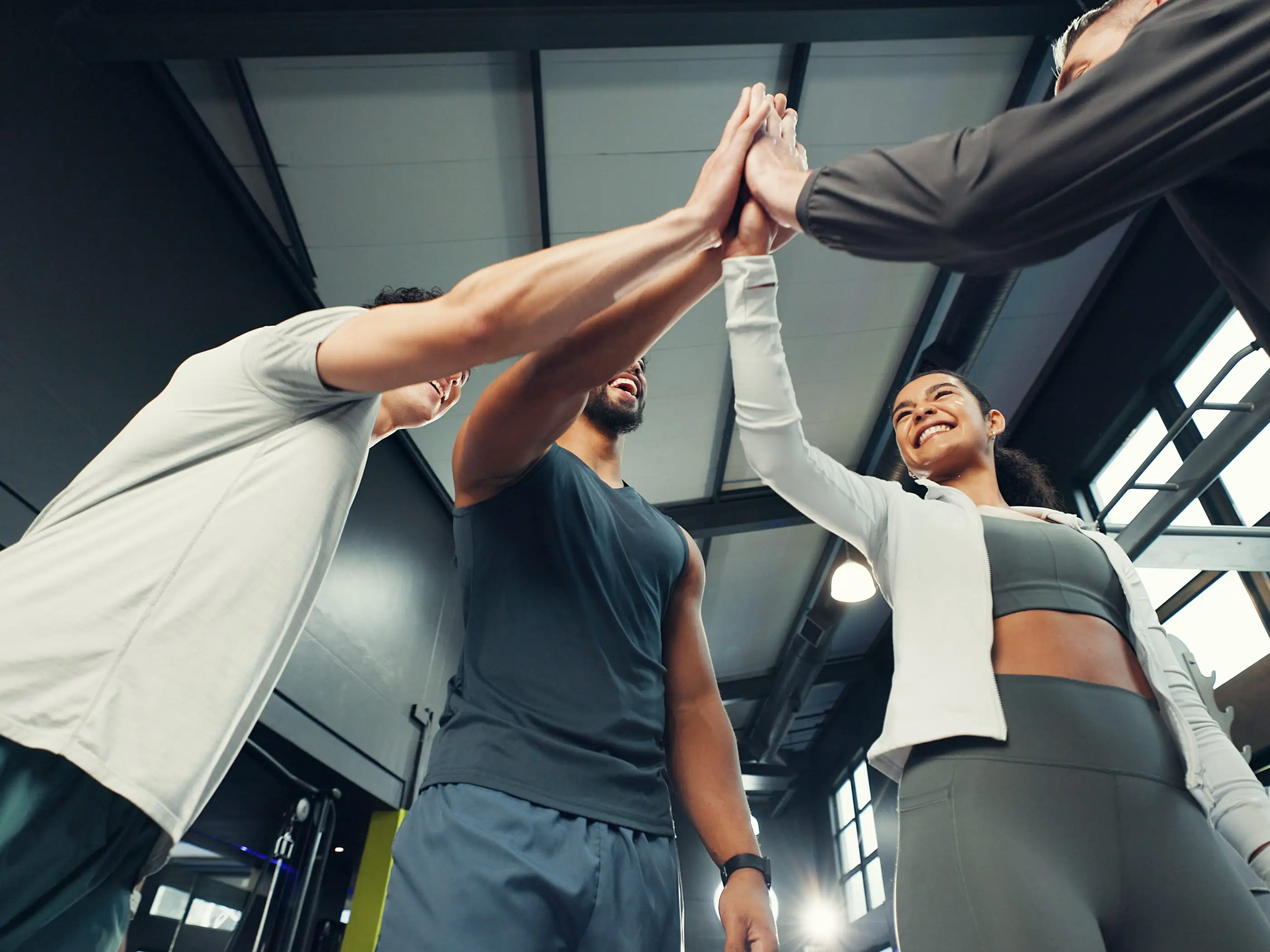 People in workout clothes high-fiving
