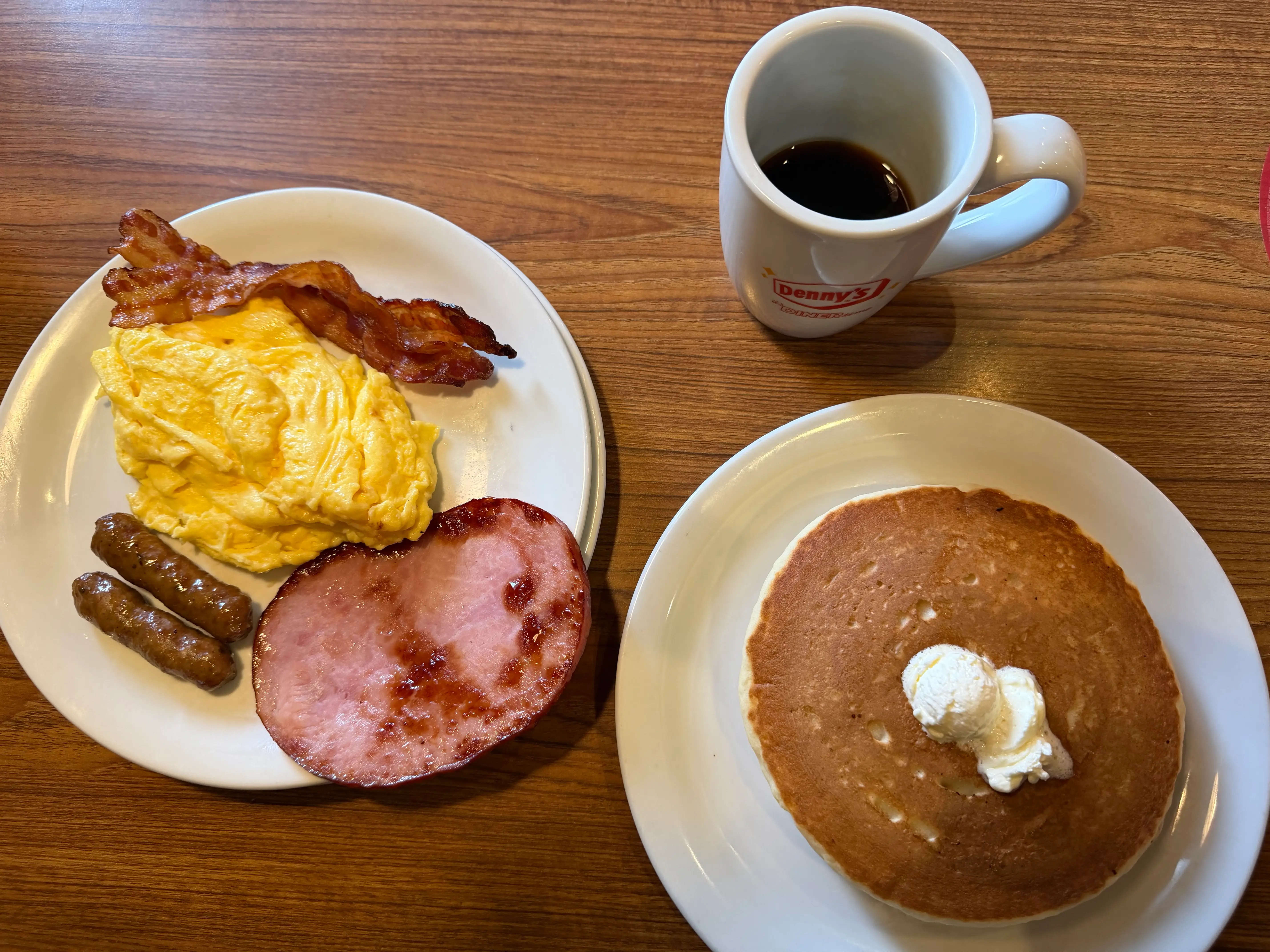 Grand Slam with ham, sausage, bacon, eggs, pancakes, coffee at Denny's
