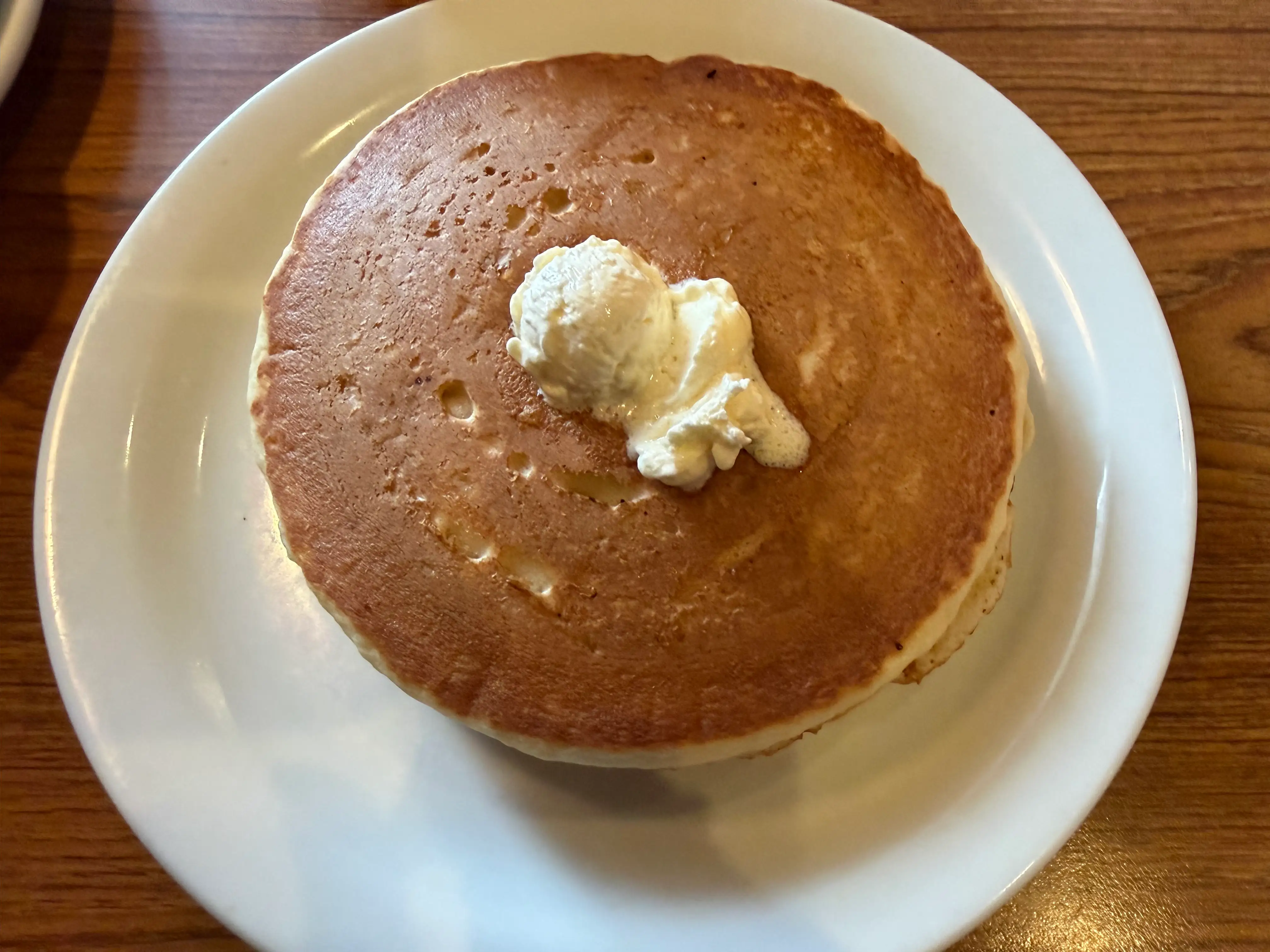 Plate of pancakes with butter on top at Denny's