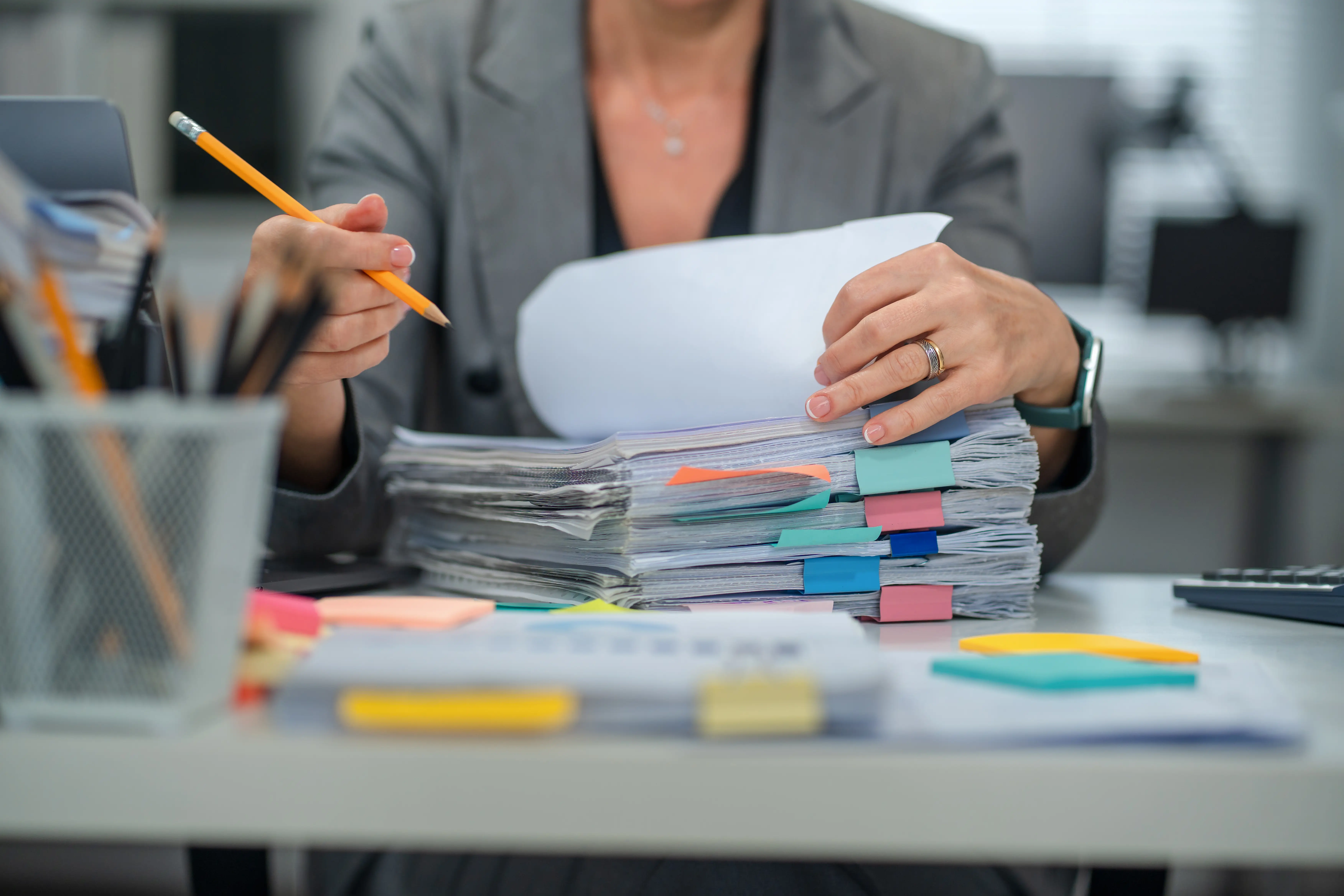 A pile of work documents is pictured.