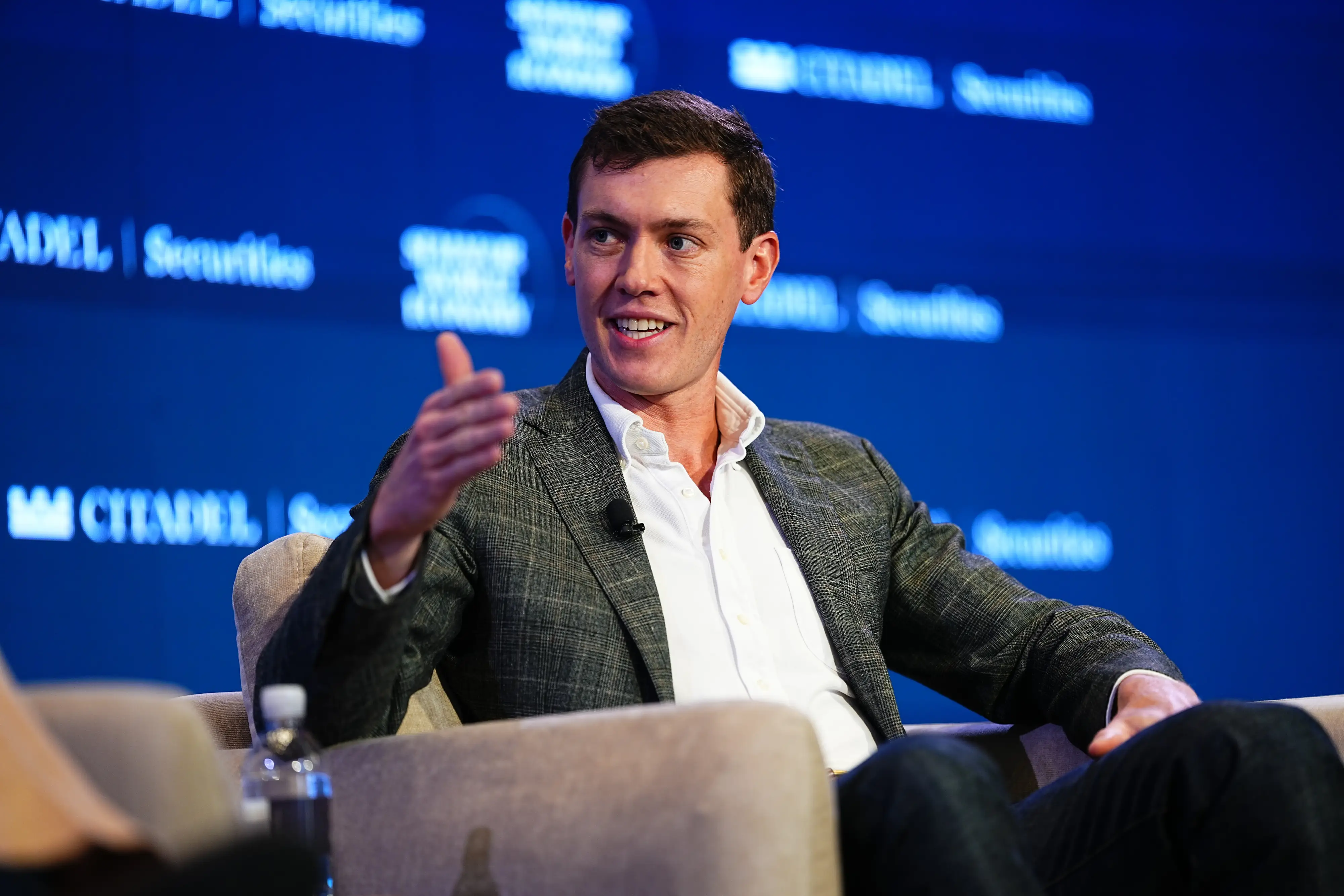 Flock CEO Garrett Langley talks onstage during an interview.