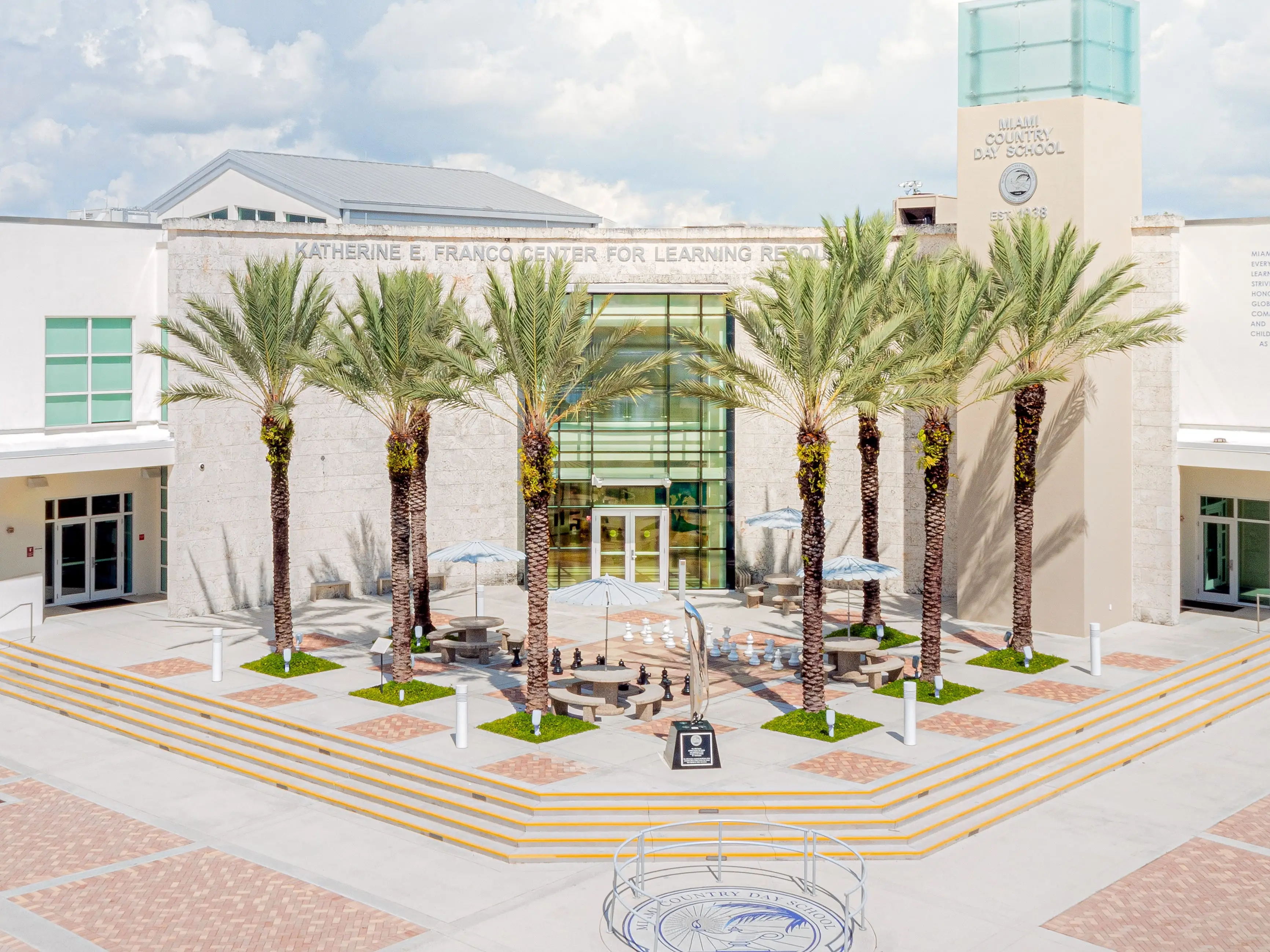 Palm-lined entrance courtyard outside the Katherine E. Franco Center for Learning Resources at Miami Country Day School.