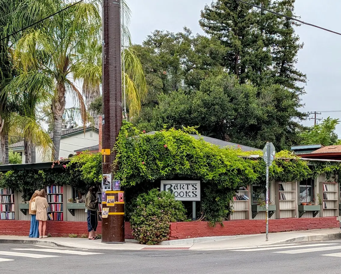 Barts Books sign among trees, greenery
