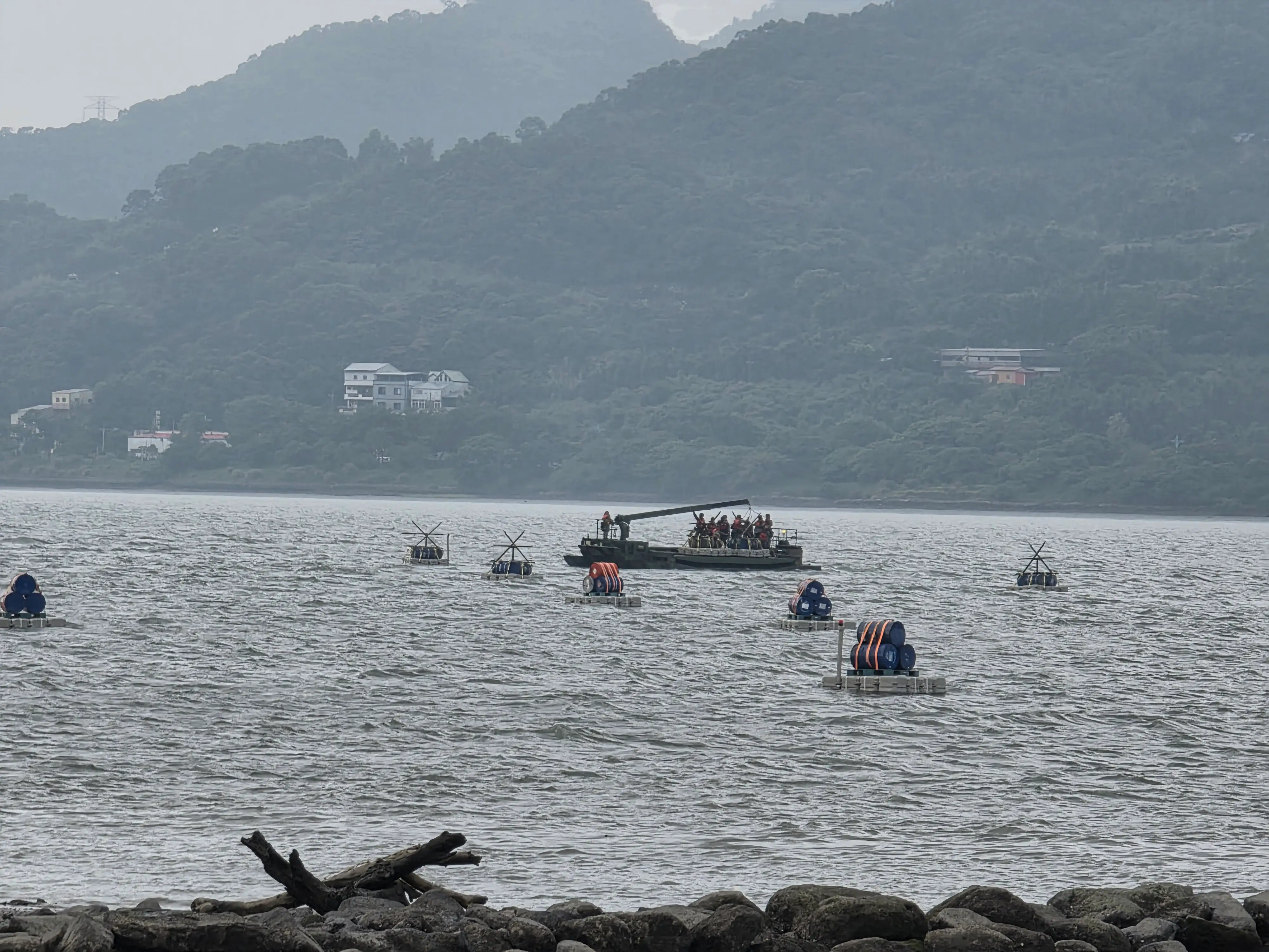 Taiwanese troops use an M83 amphibious bridging vehicle to lay pontoons across the Tamsui.