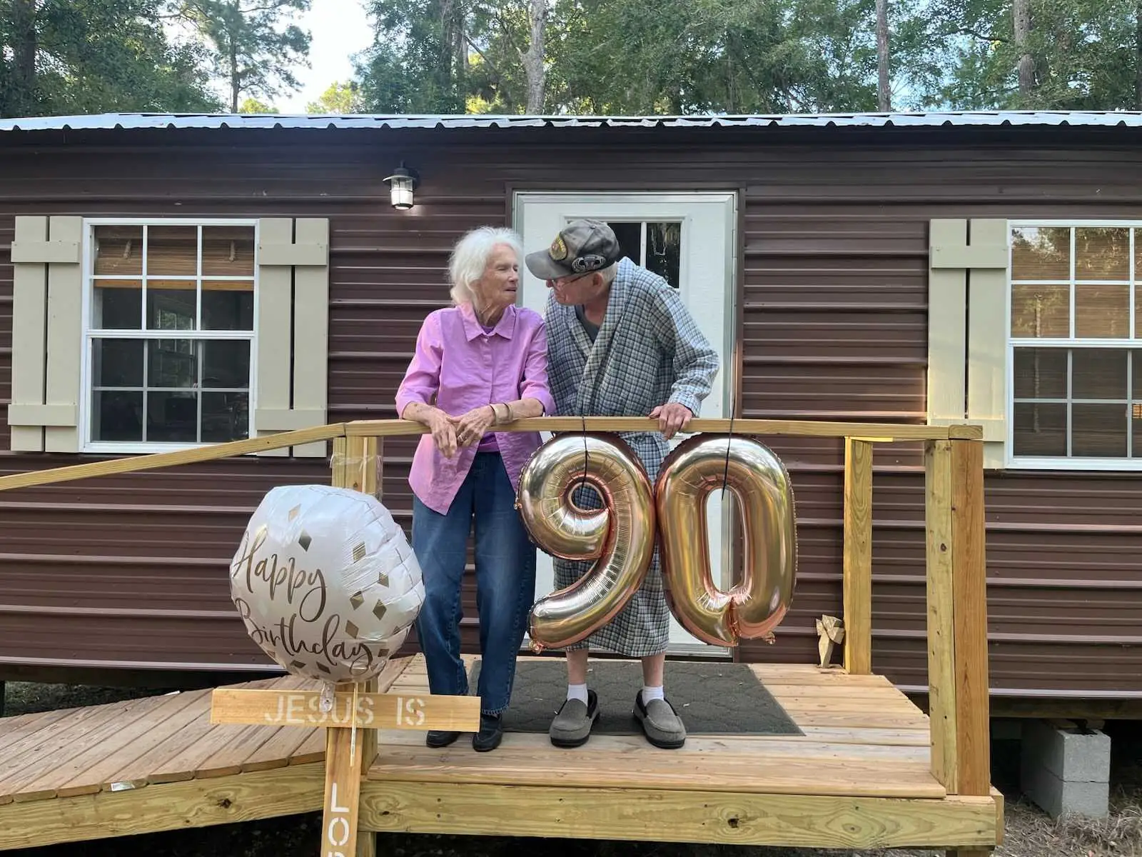 Linda Barton's parents outside their tiny home.