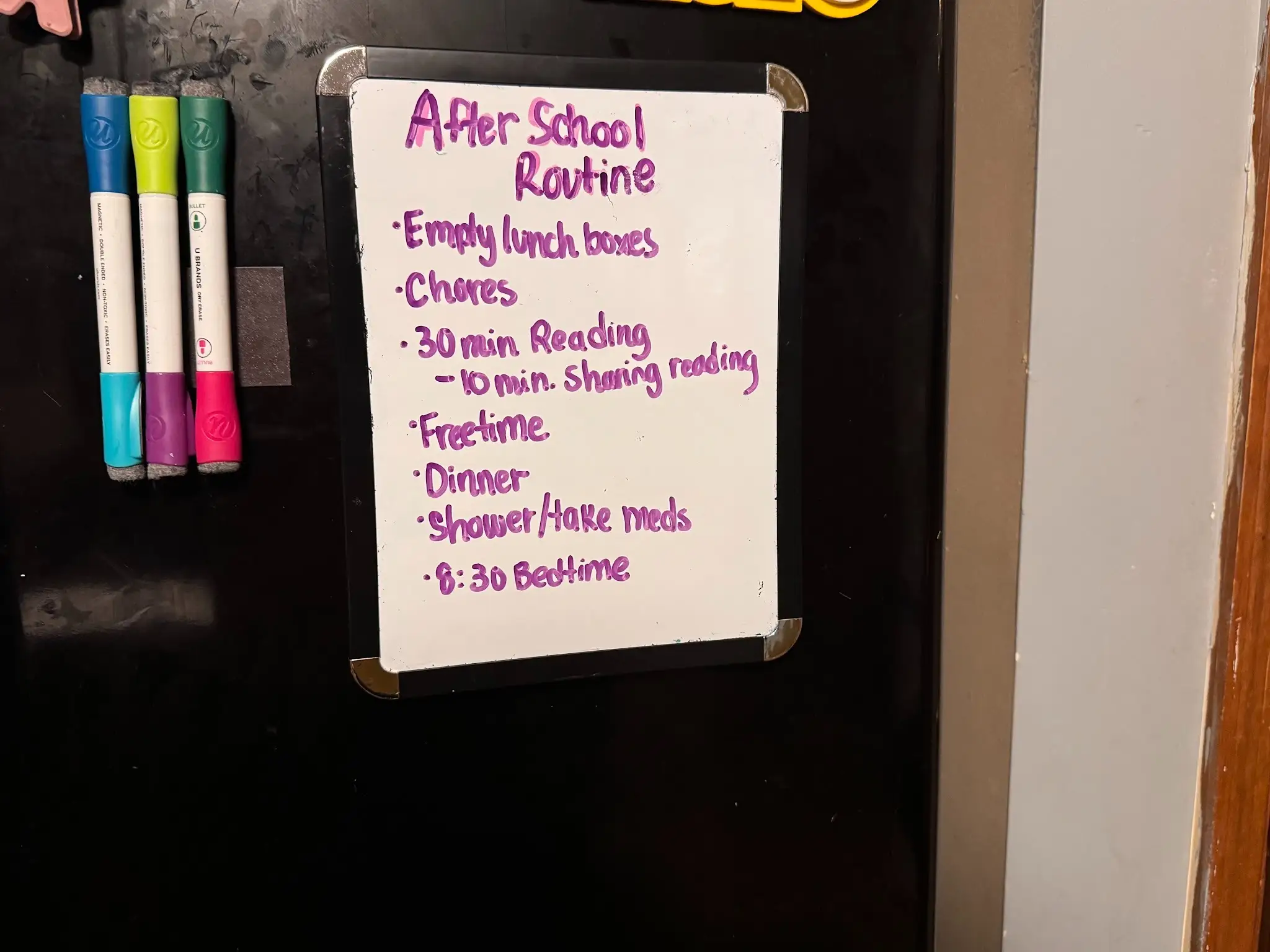 After school routine written on white board on fridge