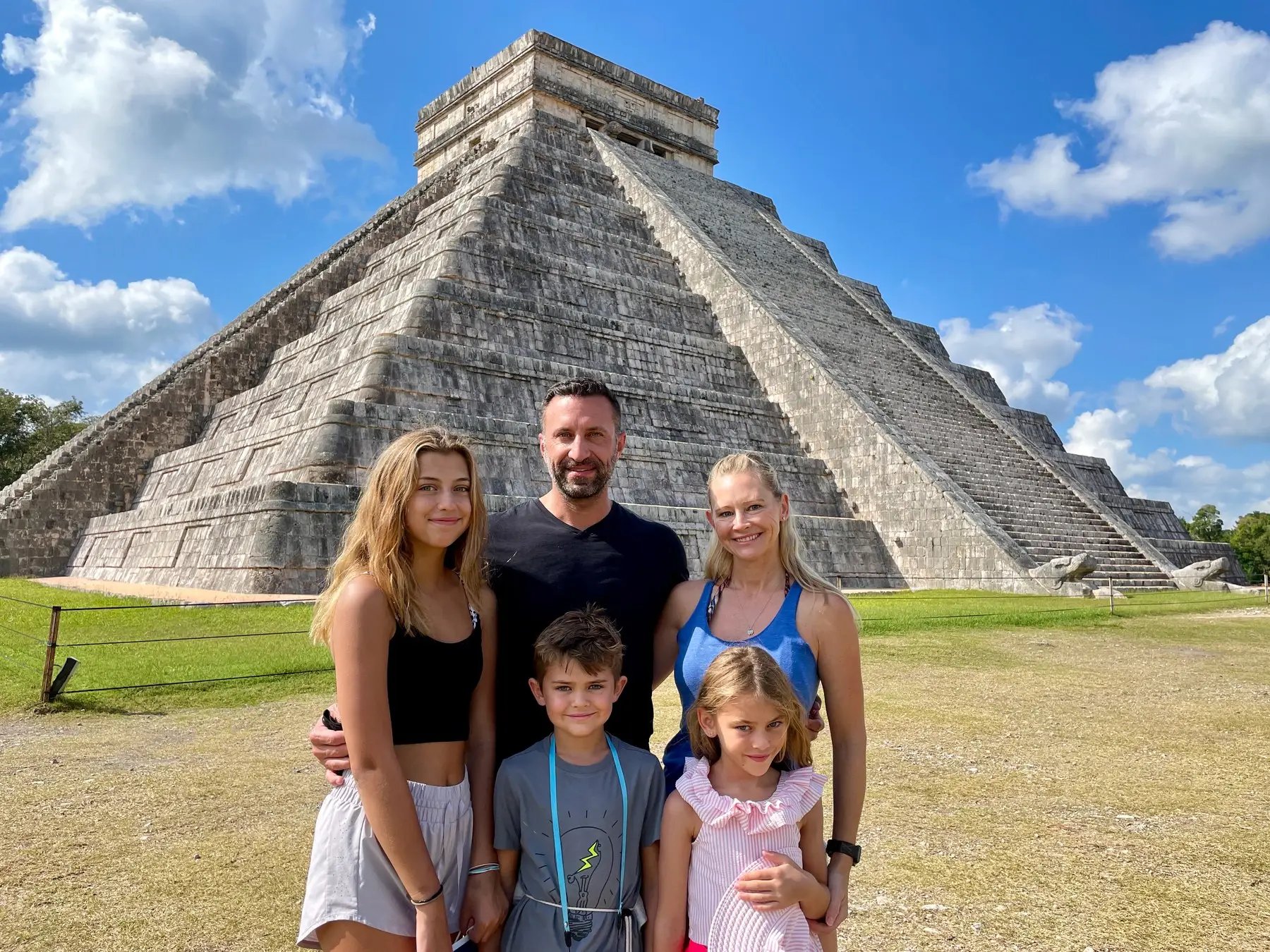Family smiling at chichen-itza