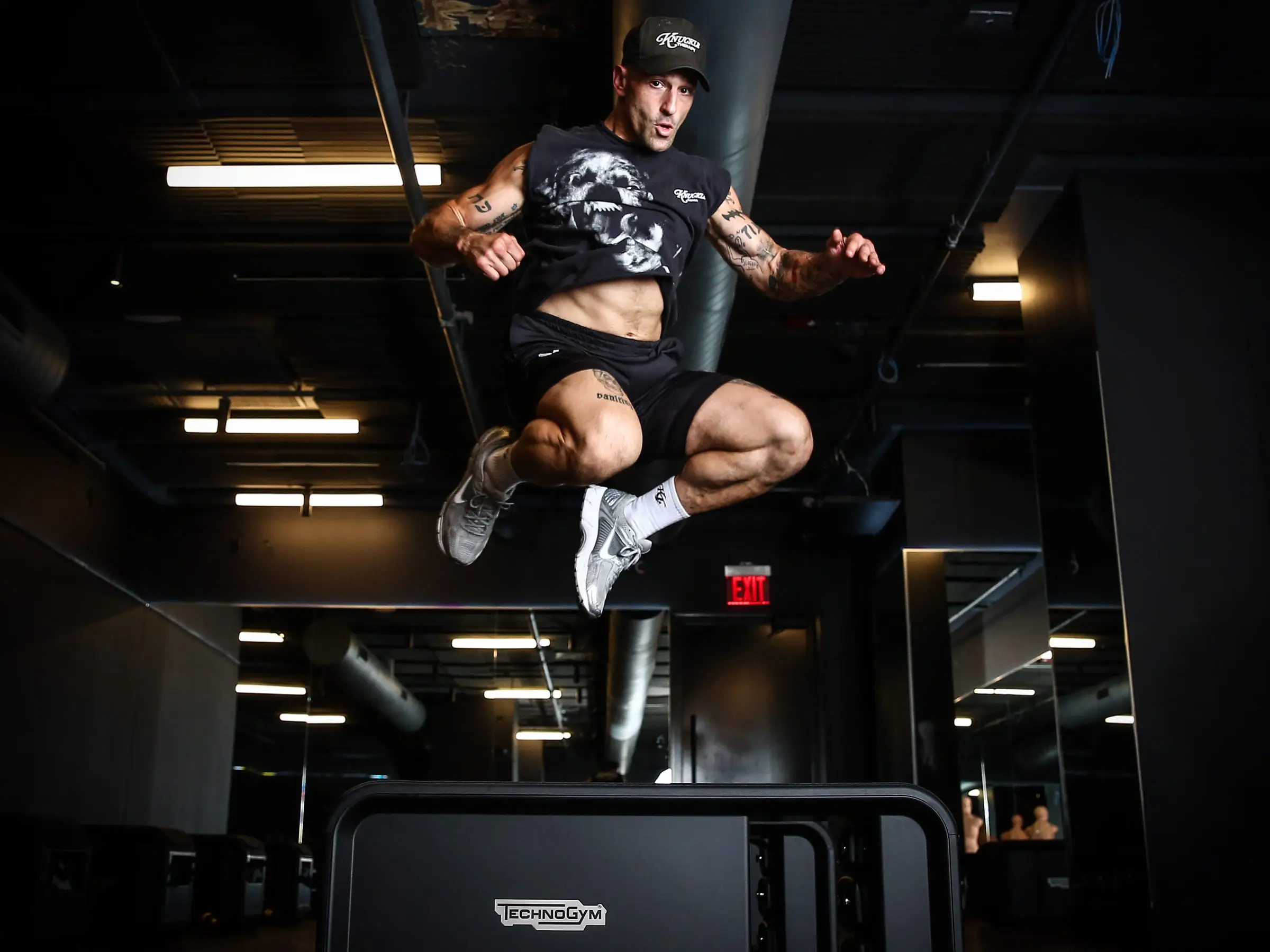 Noah Neiman jumping up at workout studio.