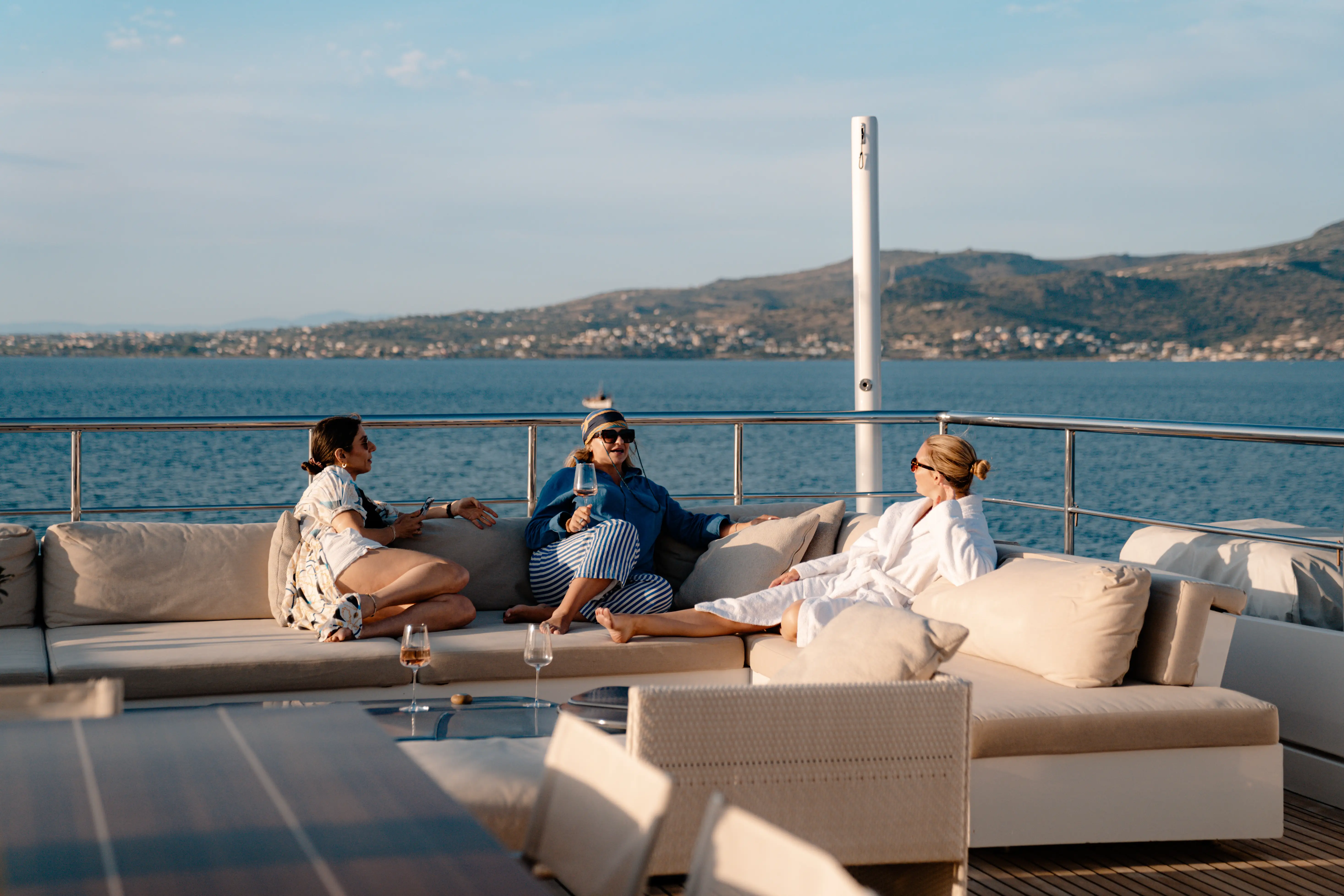 People sitting on couches on yacht