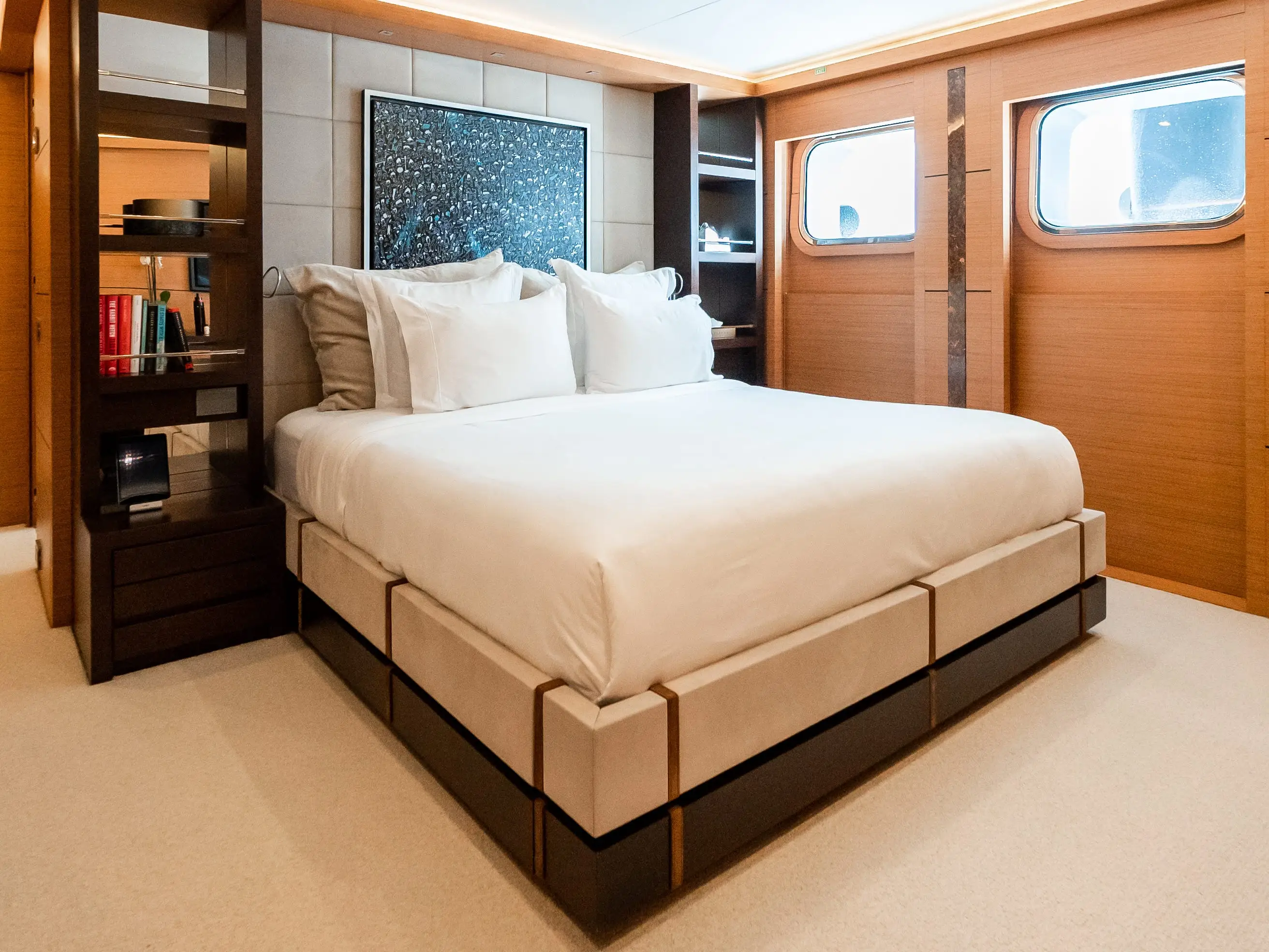 Bed with shelves on either side on yacht