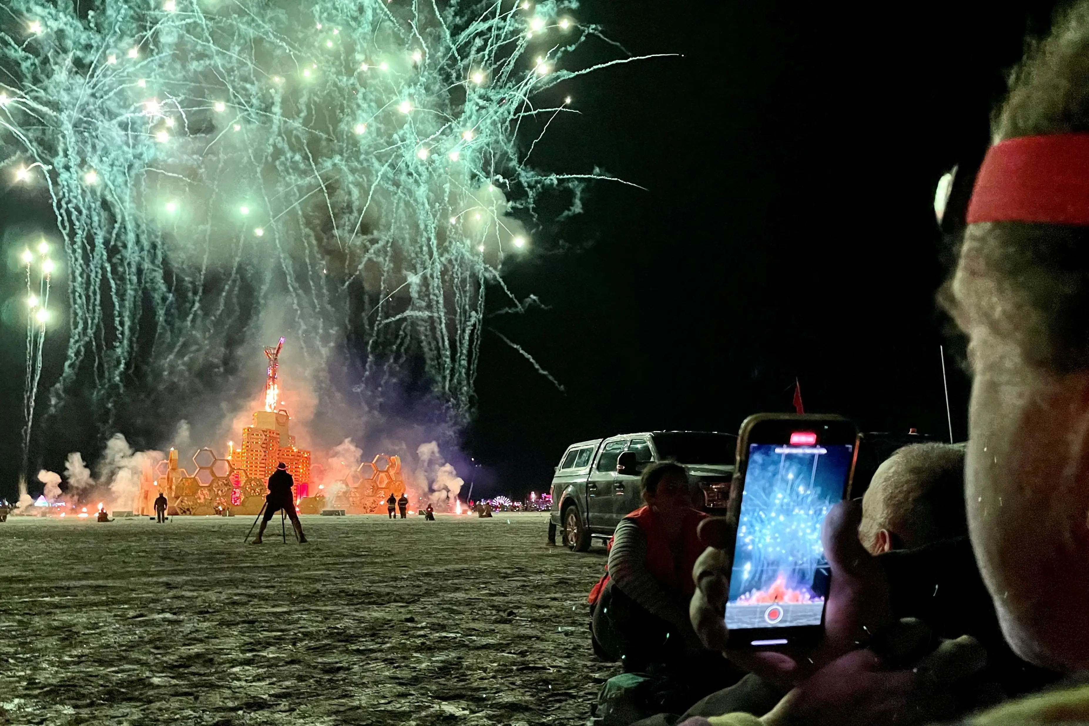 A Burner records fireworks at the festival's famous final night celebration.