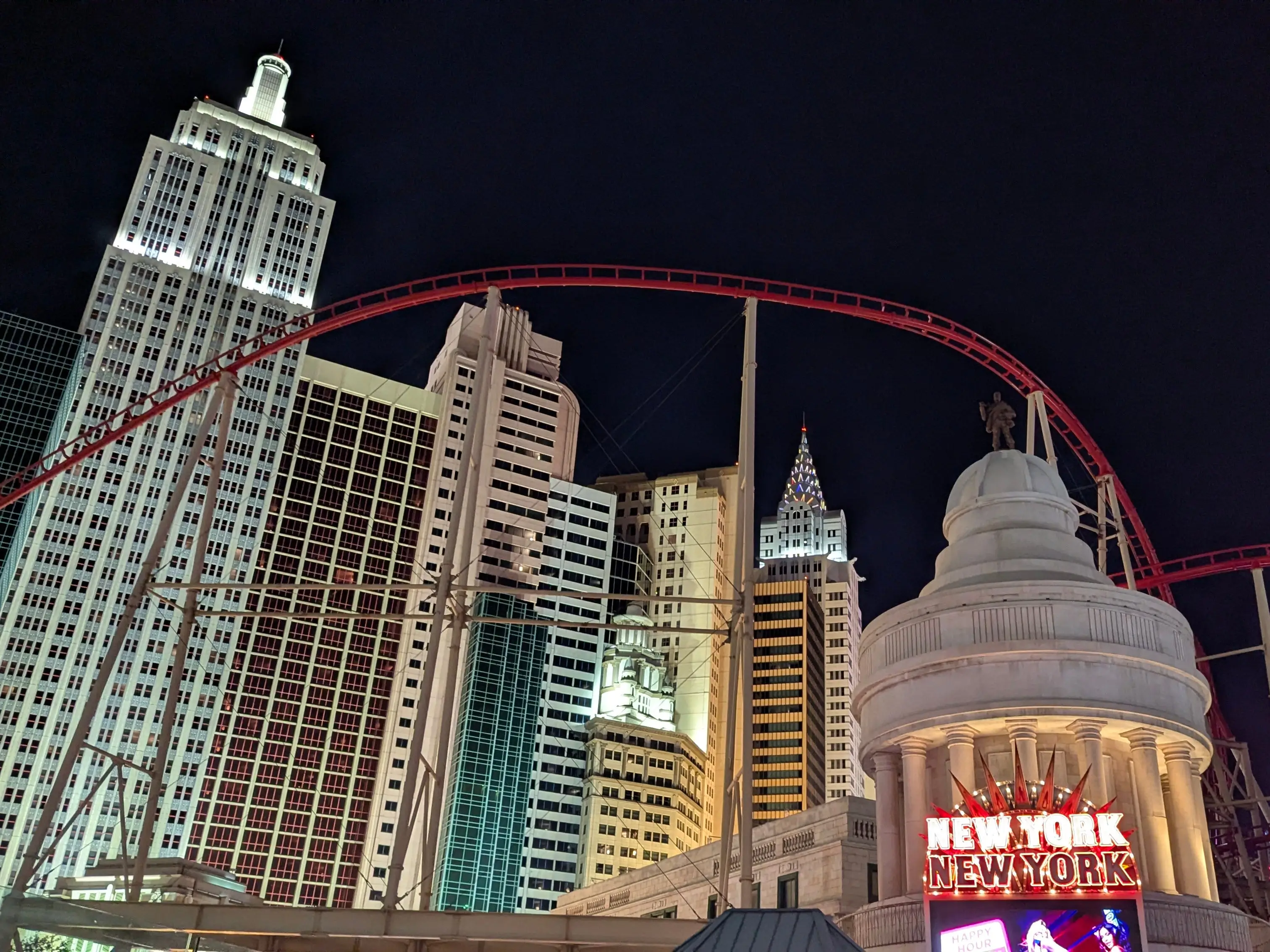 A photo of the Big Apple Coaster at night.