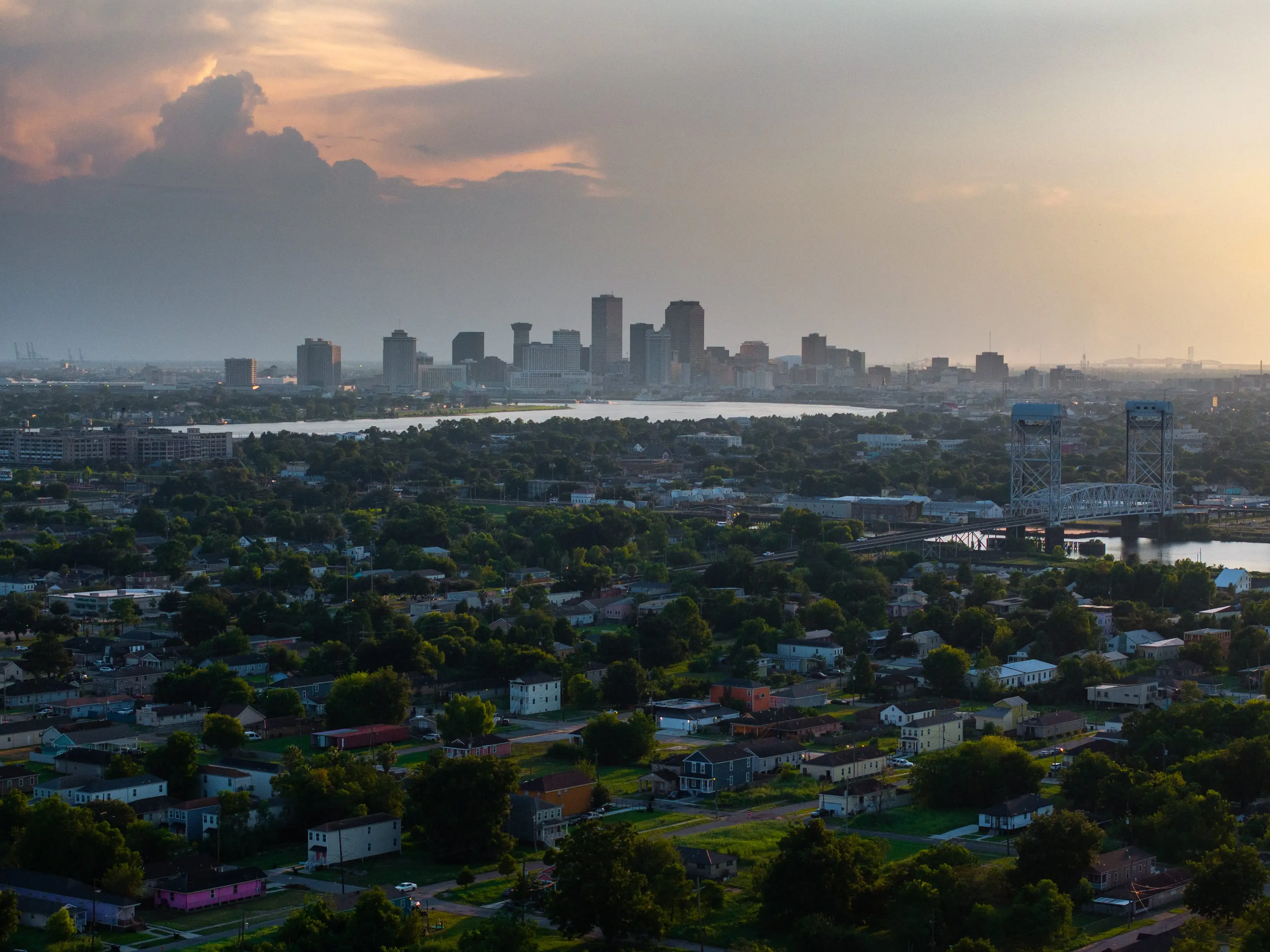 A city skyline with thunder clouds in the background