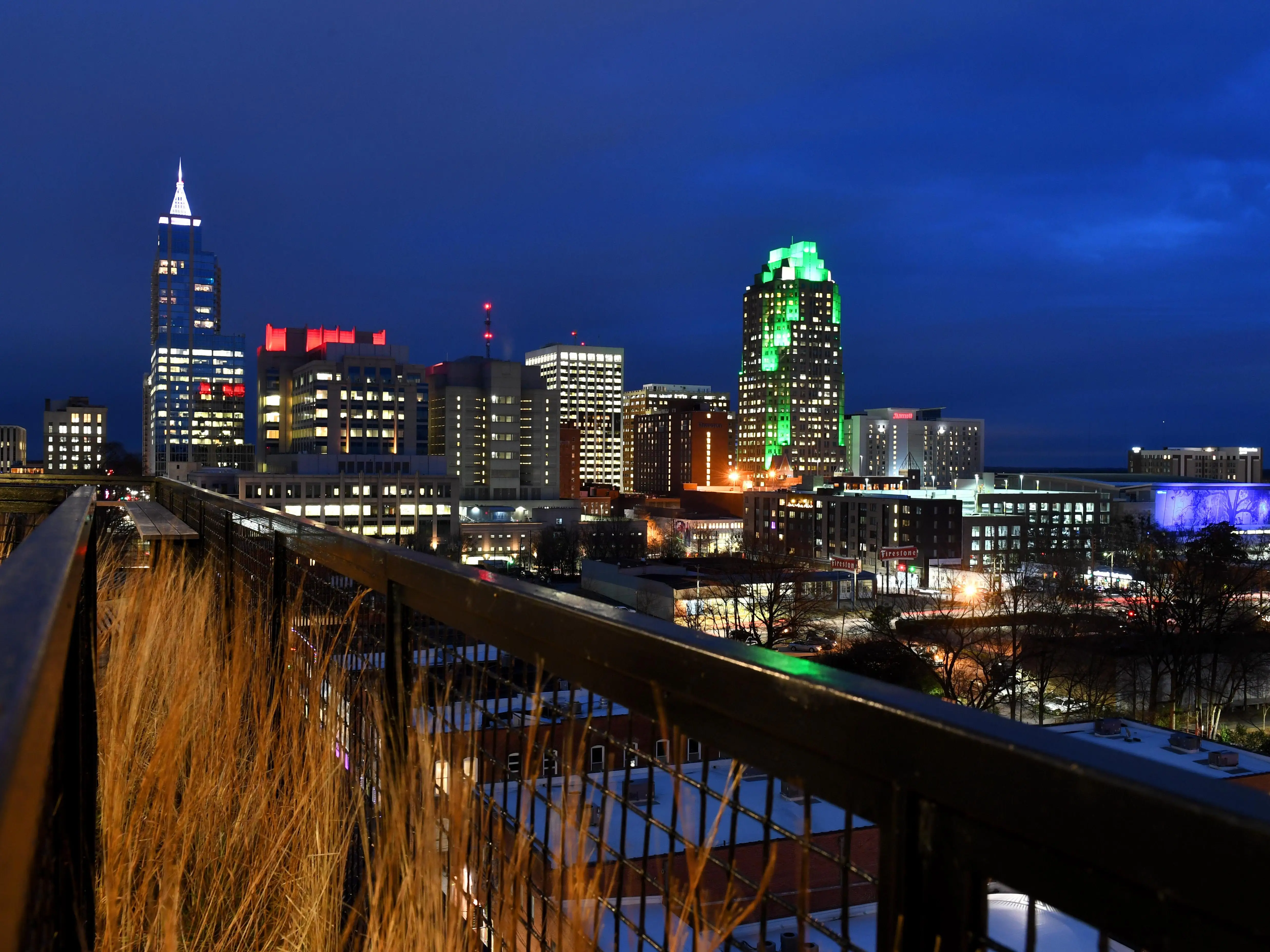 A photo of a city skyline at night.