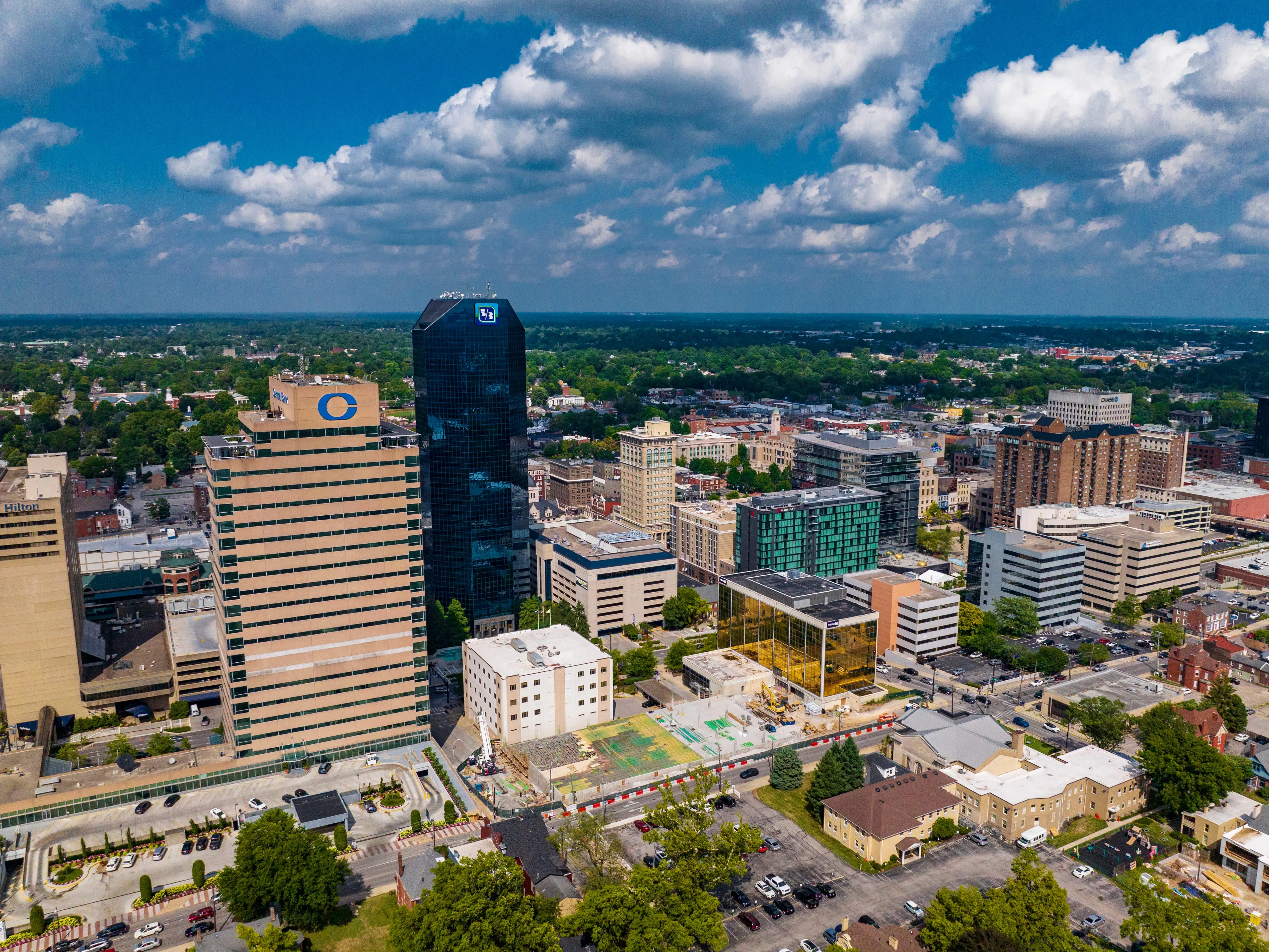 An aerial photo of a city skyline during the day.