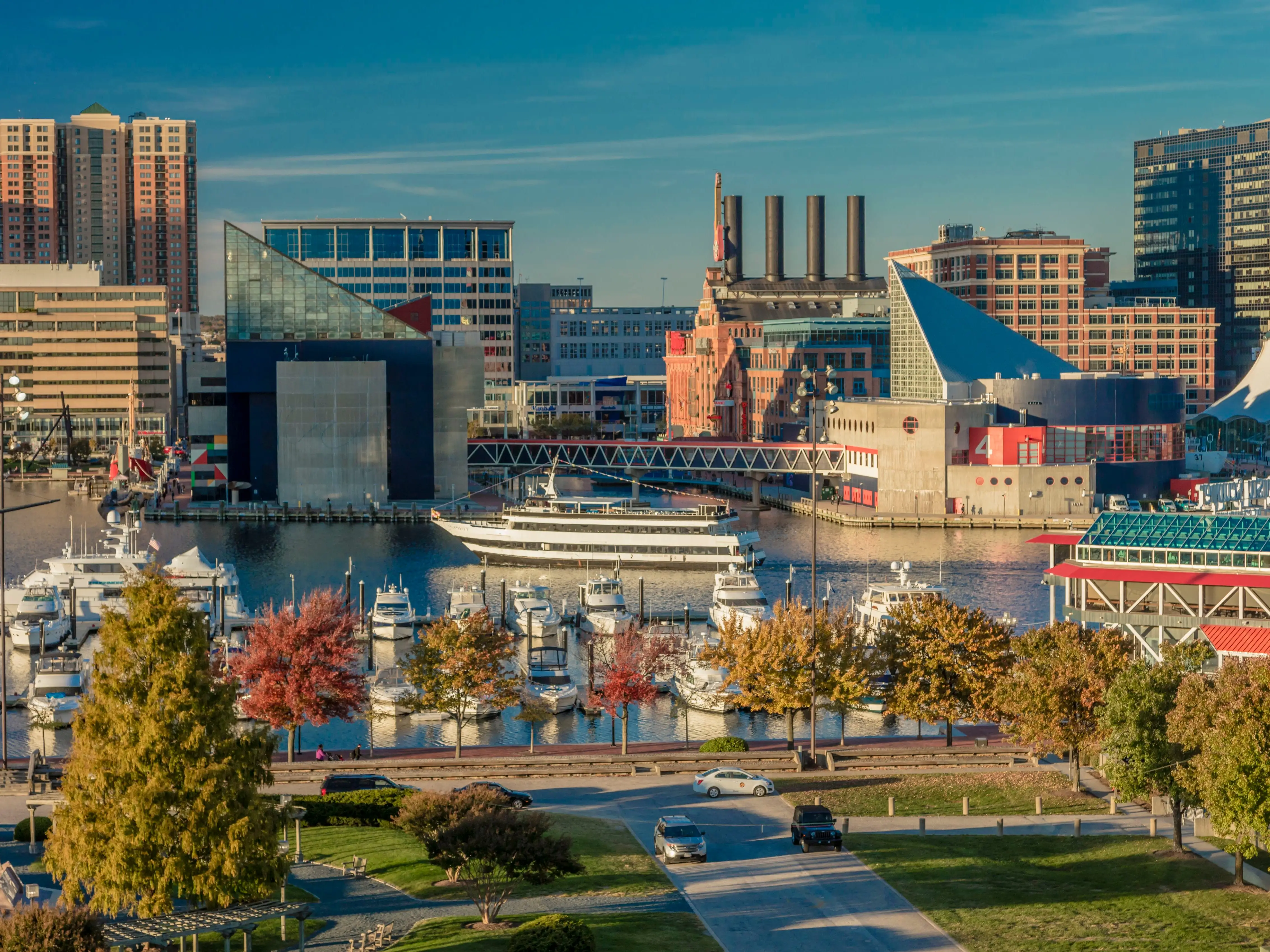A photo of a city skyline with a harbor in the foreground.