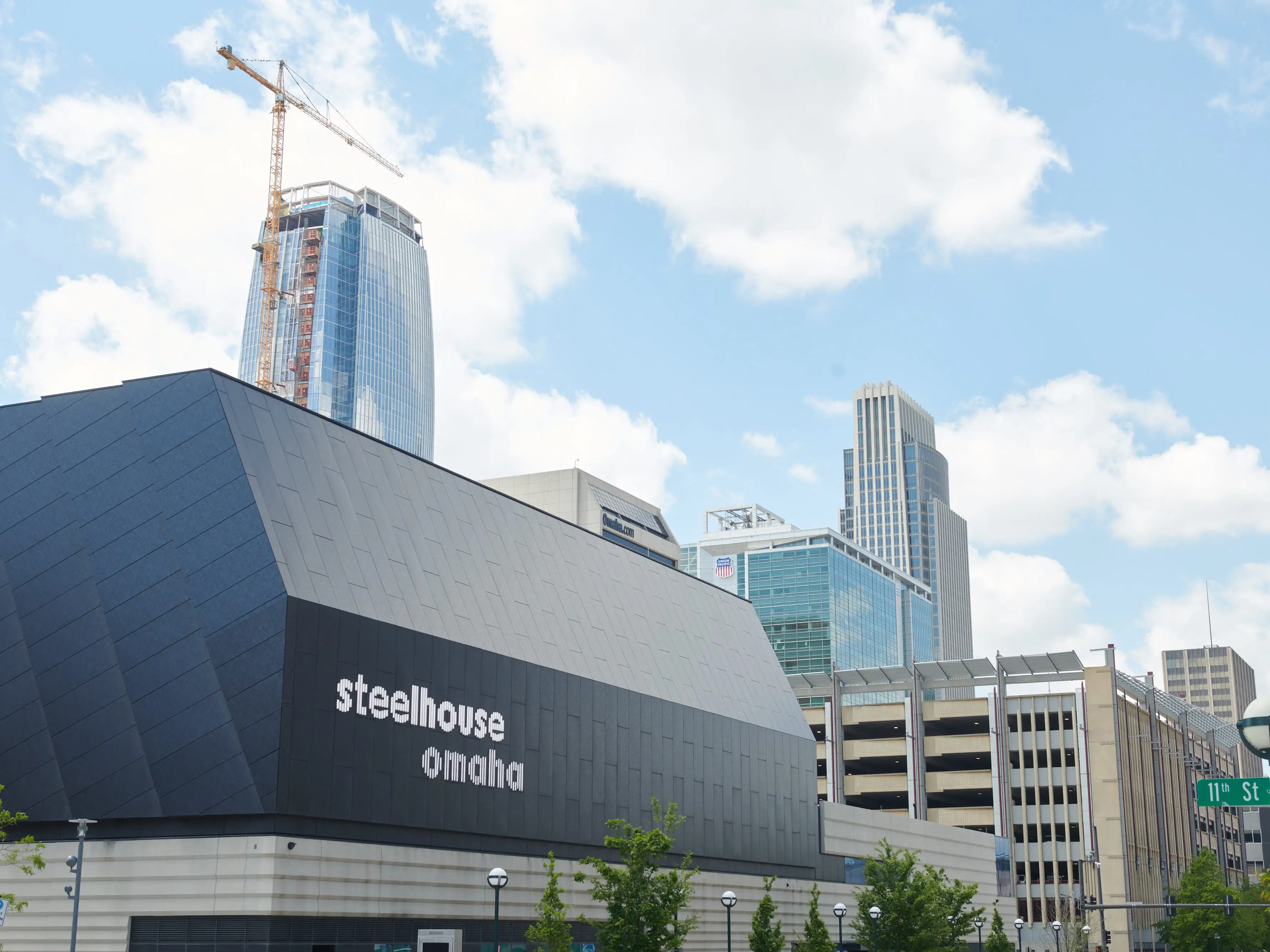 A photo of a city with a black building in the foreground.