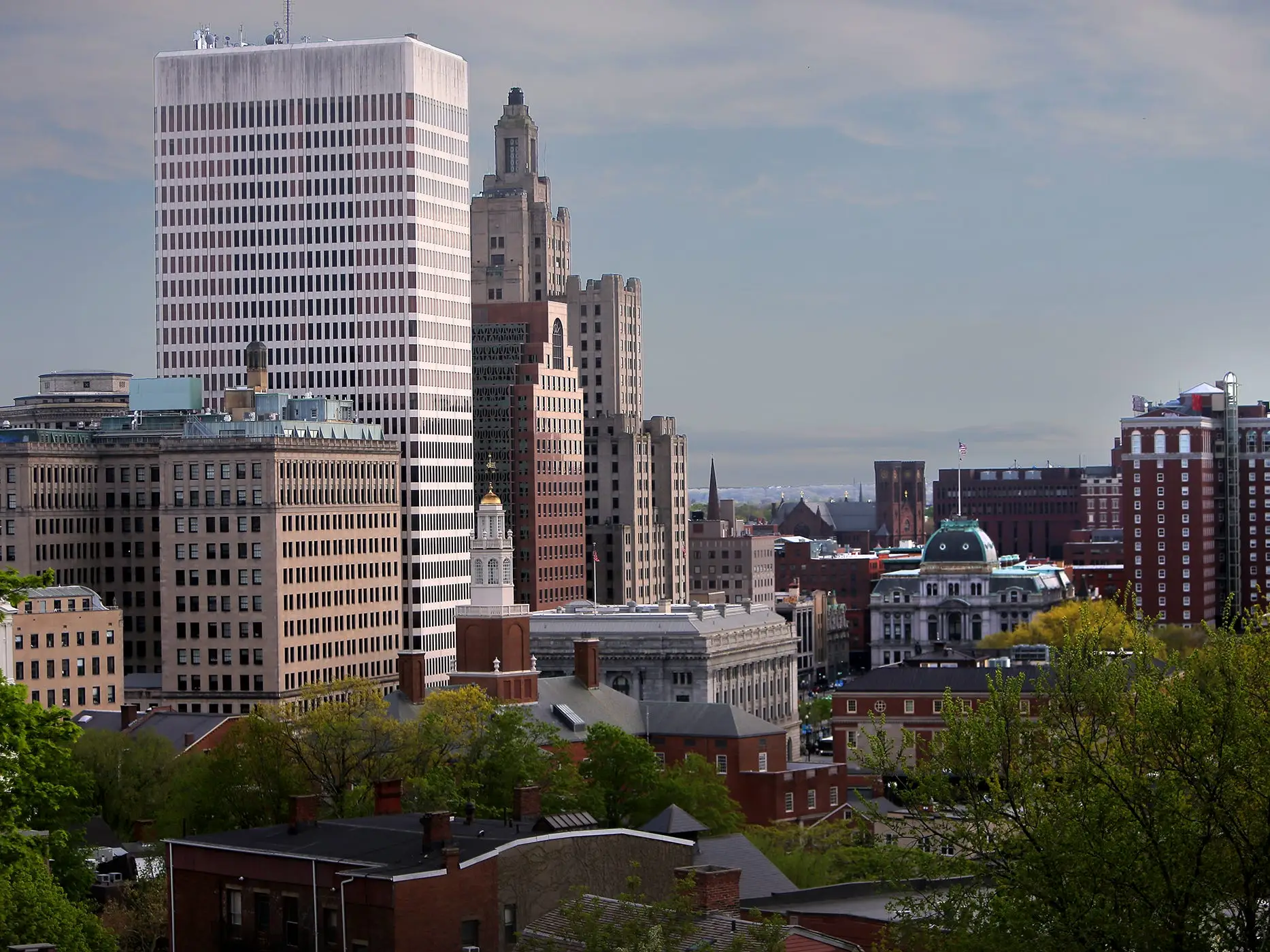 A photo of a city skyline and red brick buildings.
