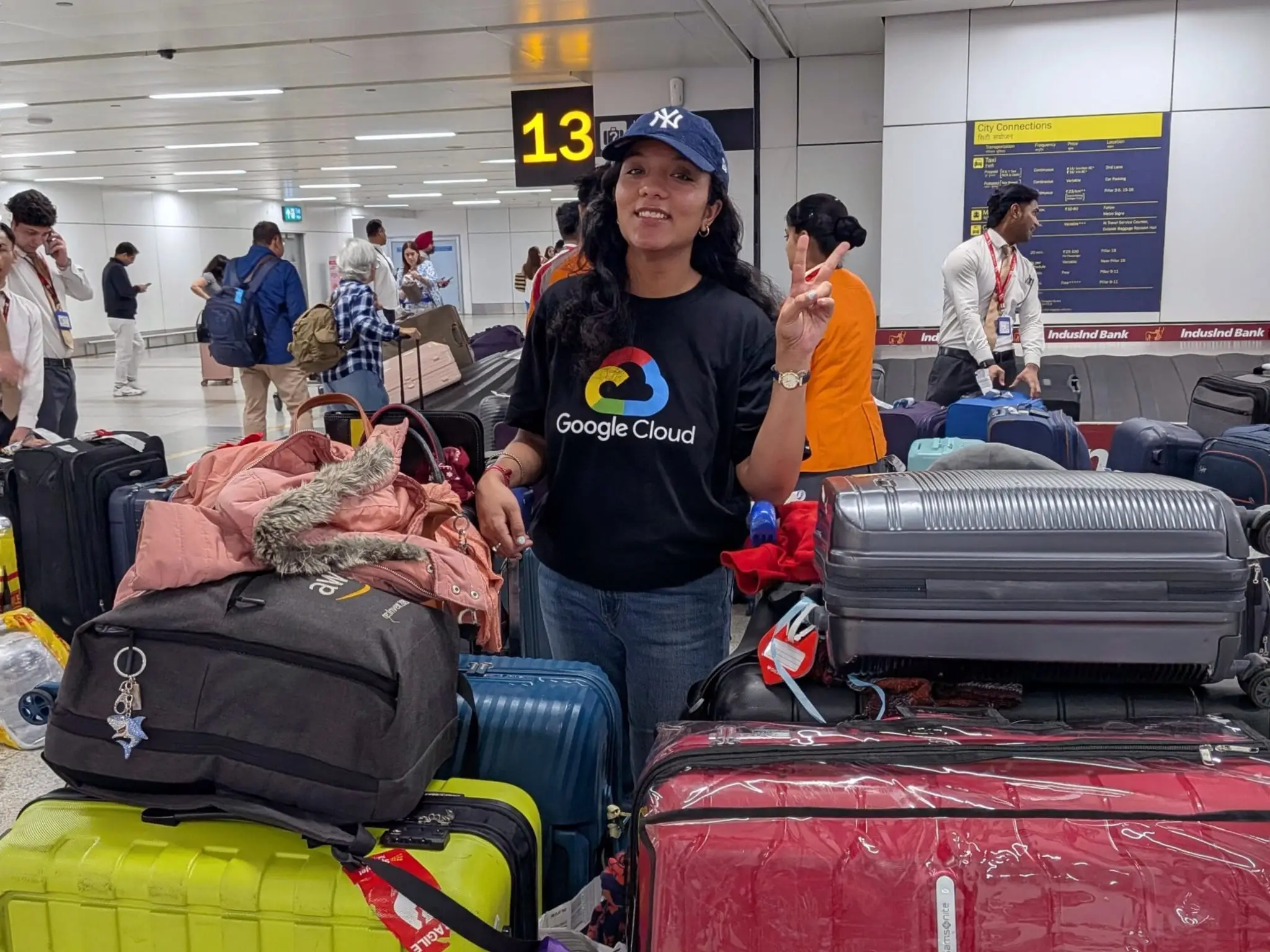 Disha Lamba is in an airport surrounded by luggage.