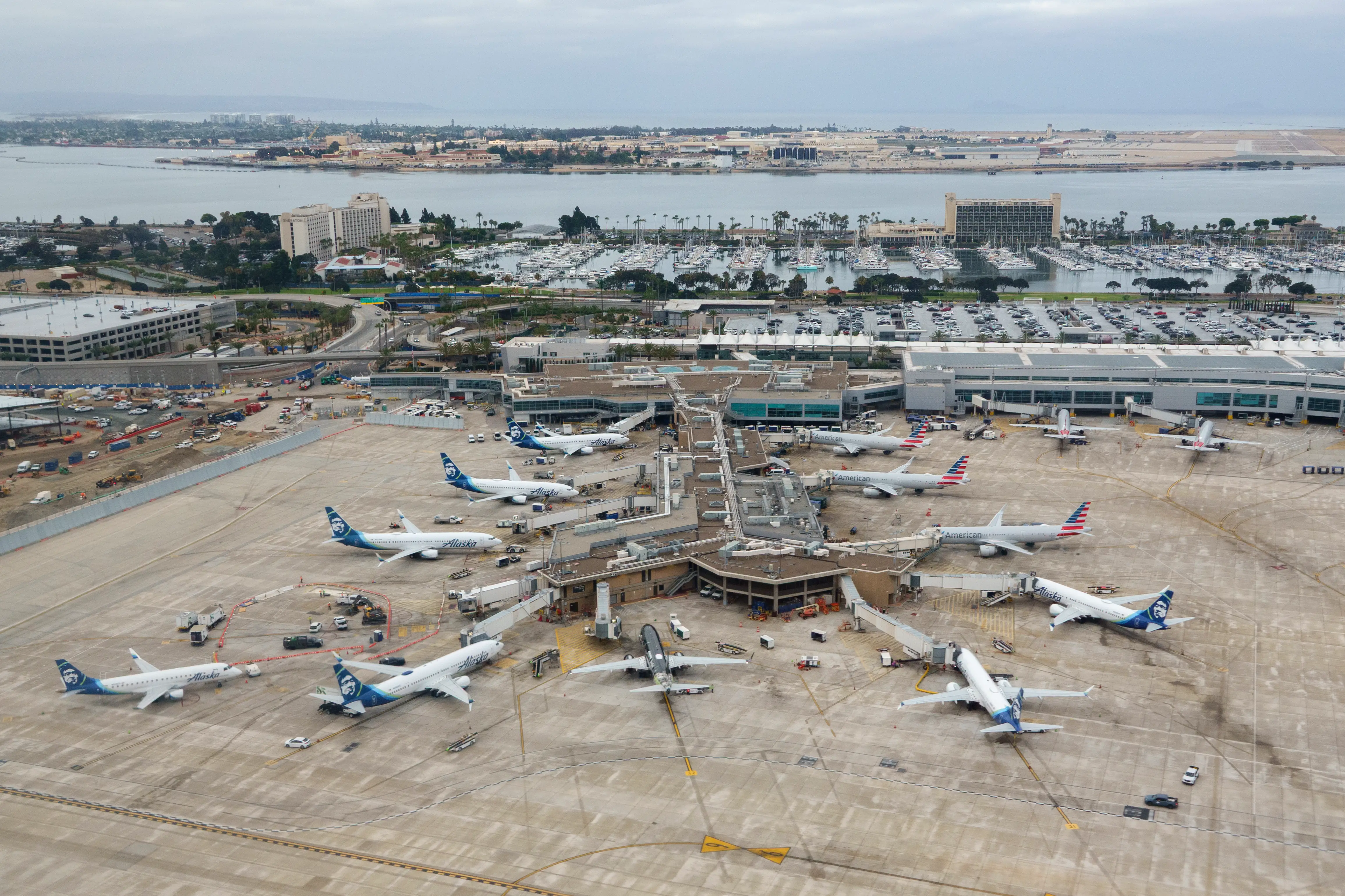 In an aerial view, airplanes are parked at San Diego International Airport's Terminal 2.
