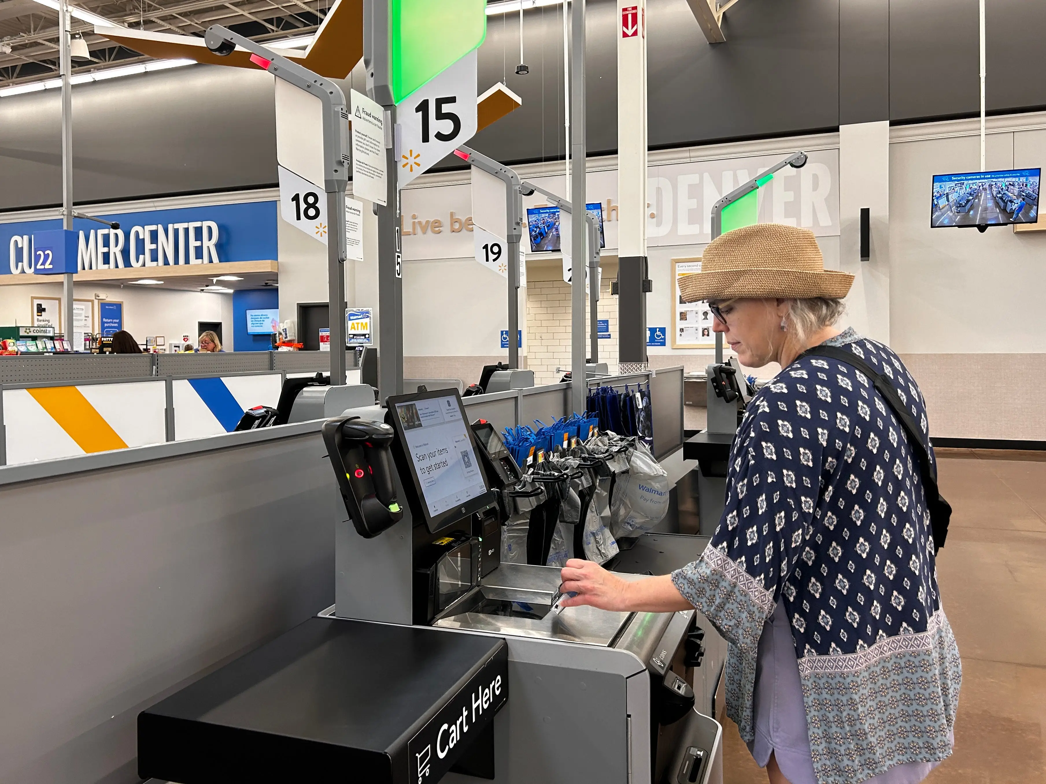 A shopper checks out at a Walmart store in California.