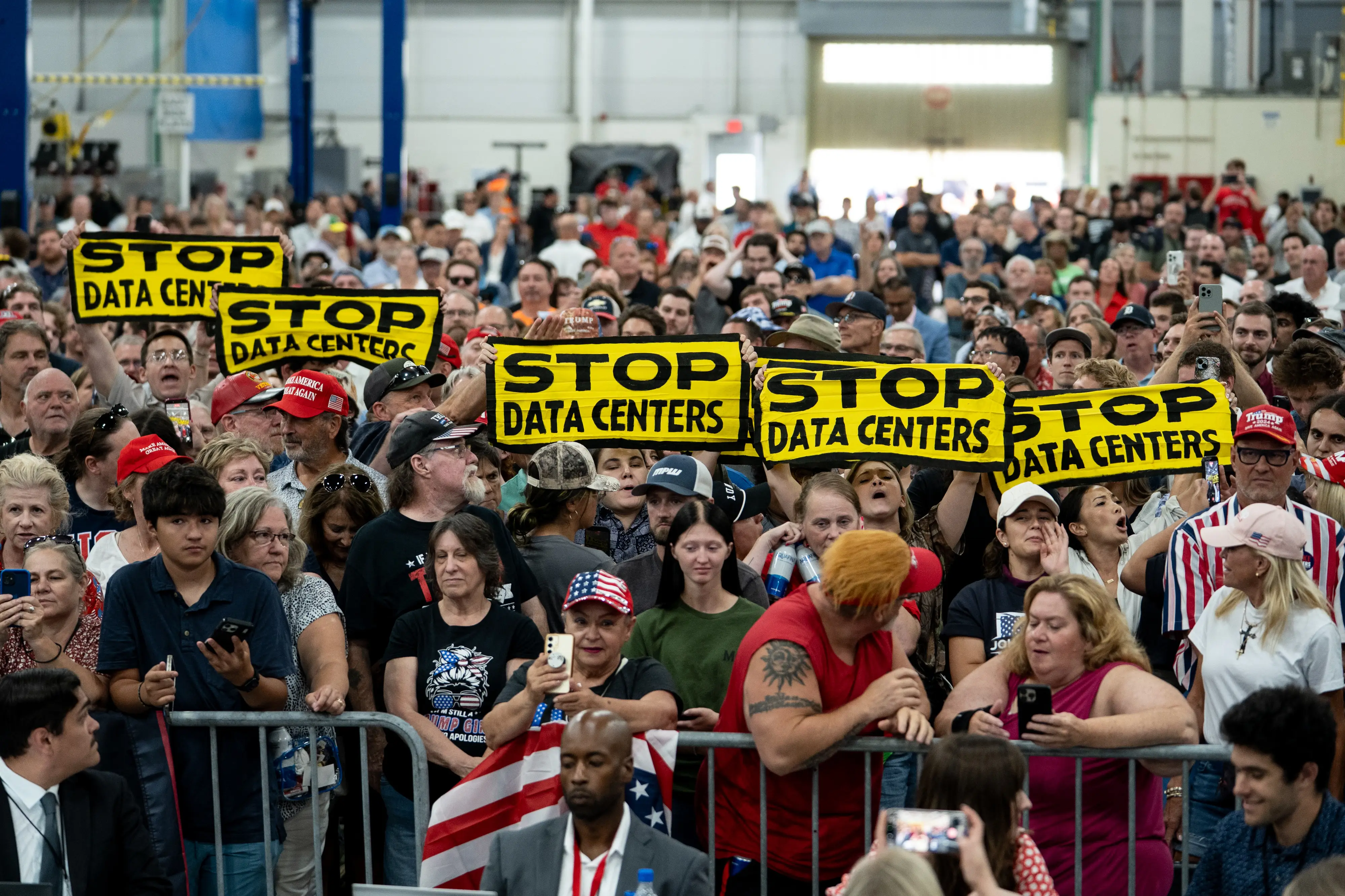 Anti-data center protestors at a Donald Trump rally in Michigan, July 2026