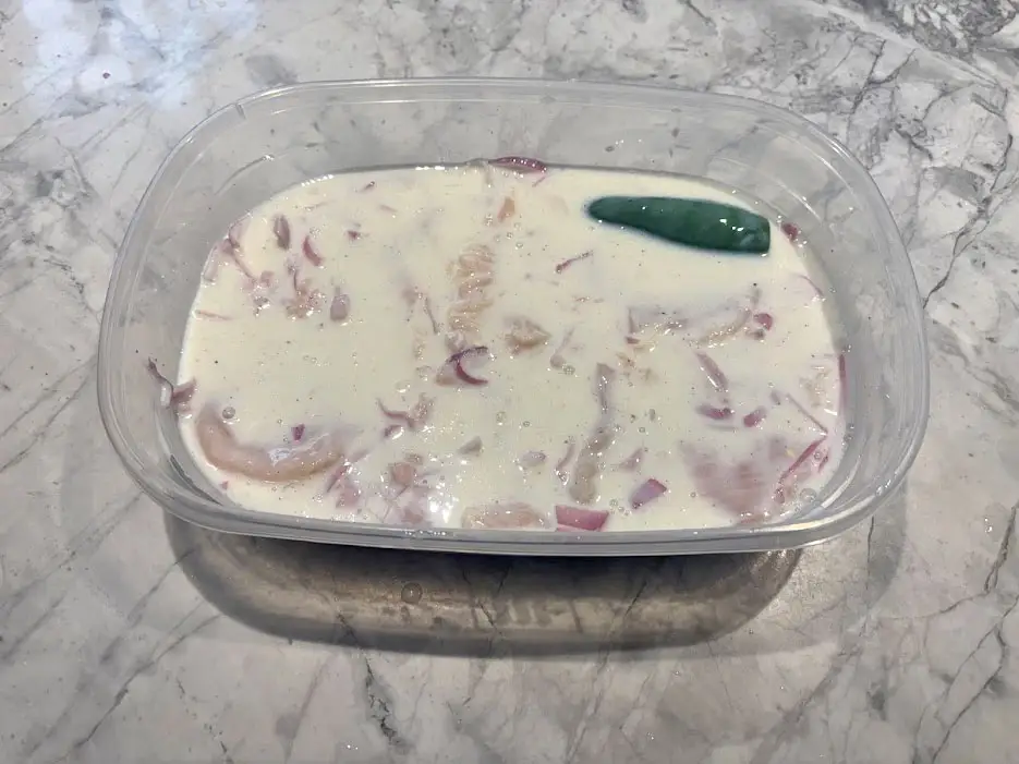 Chicken cutlets in marinade.