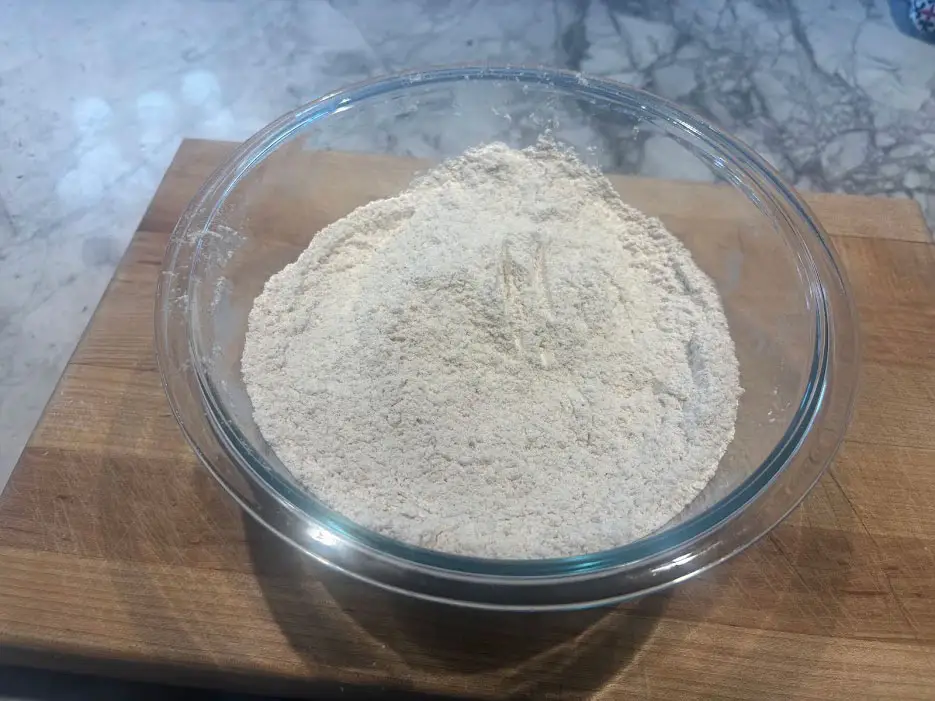 A bowl of flour and seasonings.