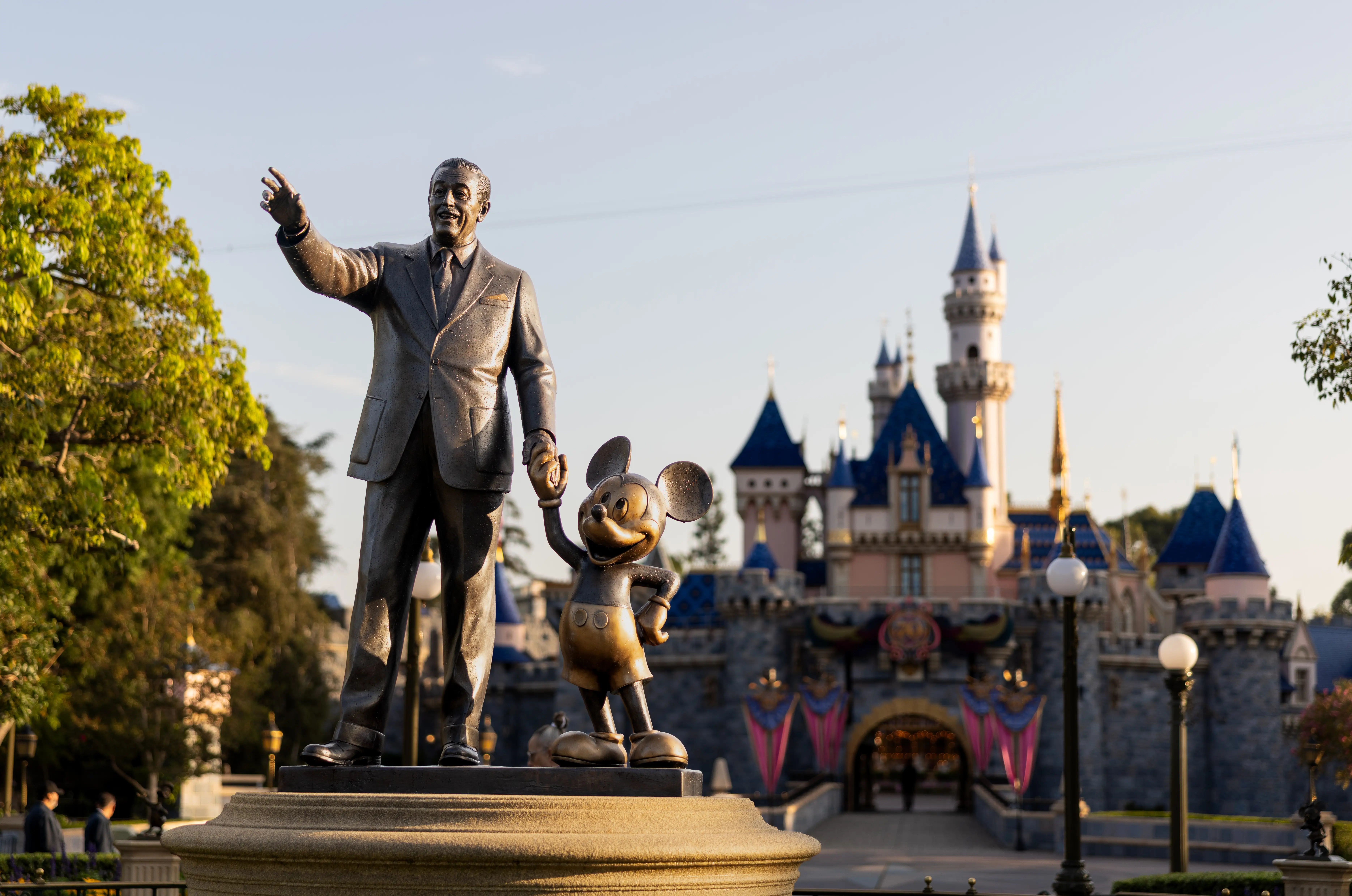 A statue of Walt Disney and Mickey Mouse at Disneyland