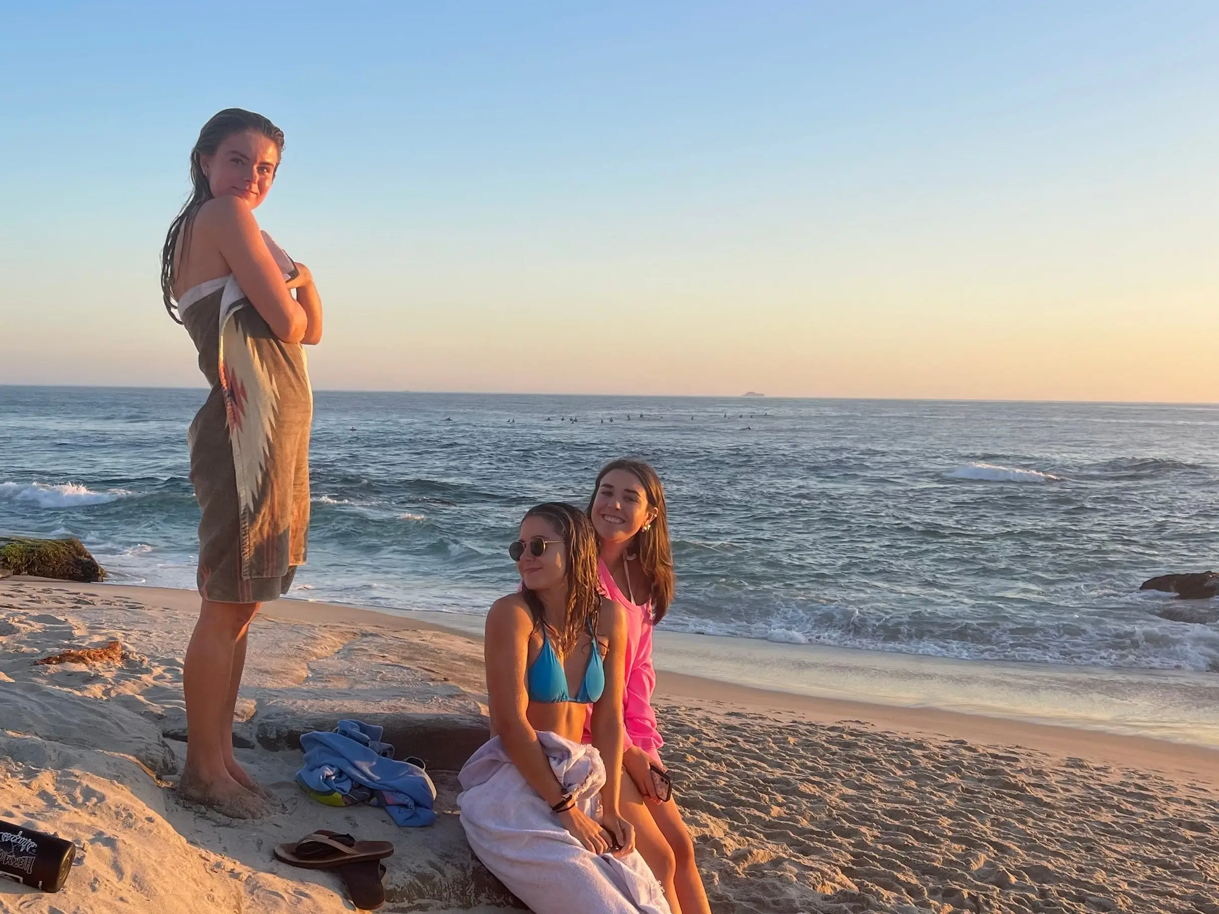 The writer and her roommates hang out at the beach at sunset in Pacific Beach, California.