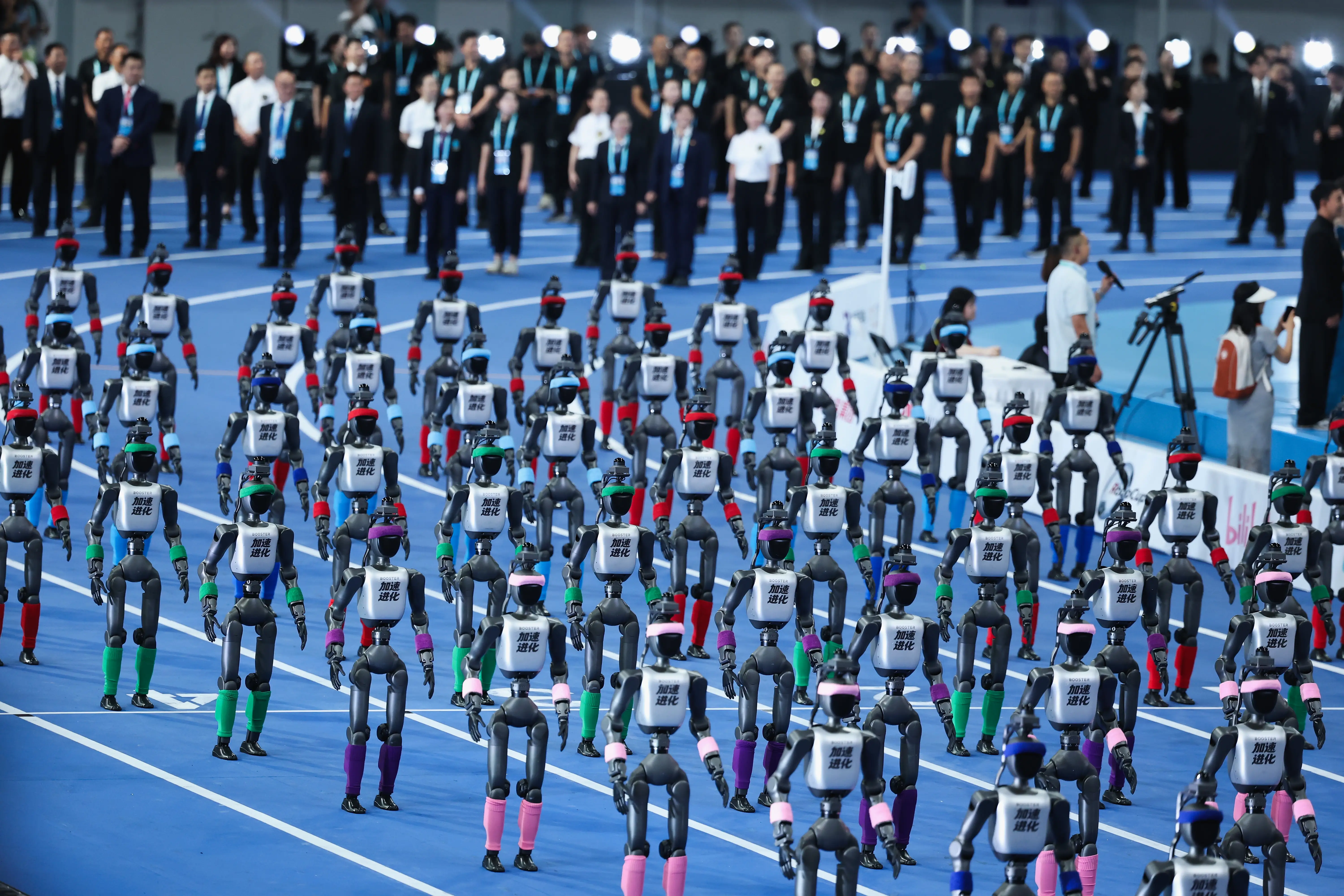 Humanoid robots parade during the 2026 World Humanoid Robot Games opening ceremony at National Speed Skating Oval on August 22, 2026 in Beijing, China.