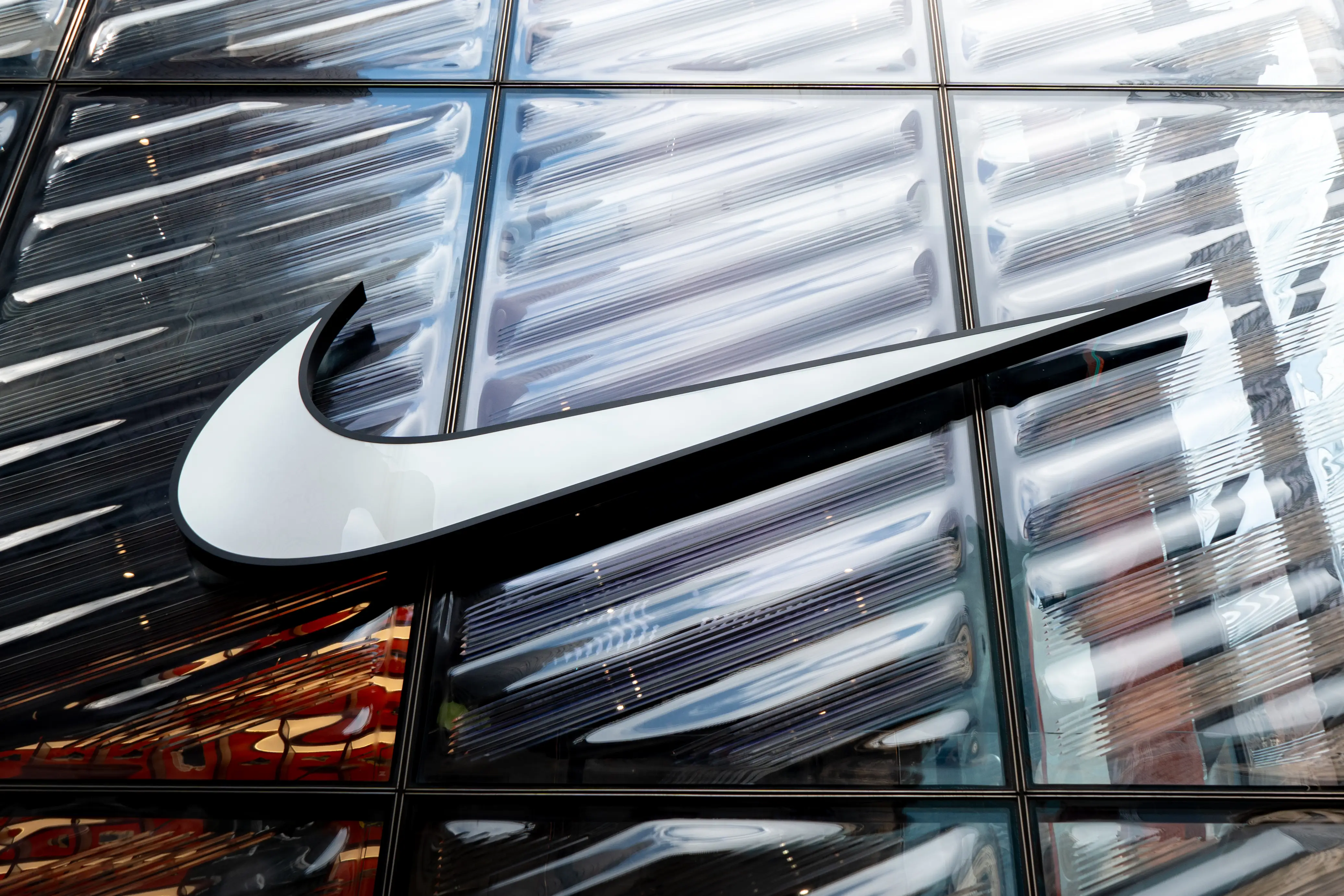 A Nike logo sign is seen on a store in New York City, United States, on August 6, 2026.
