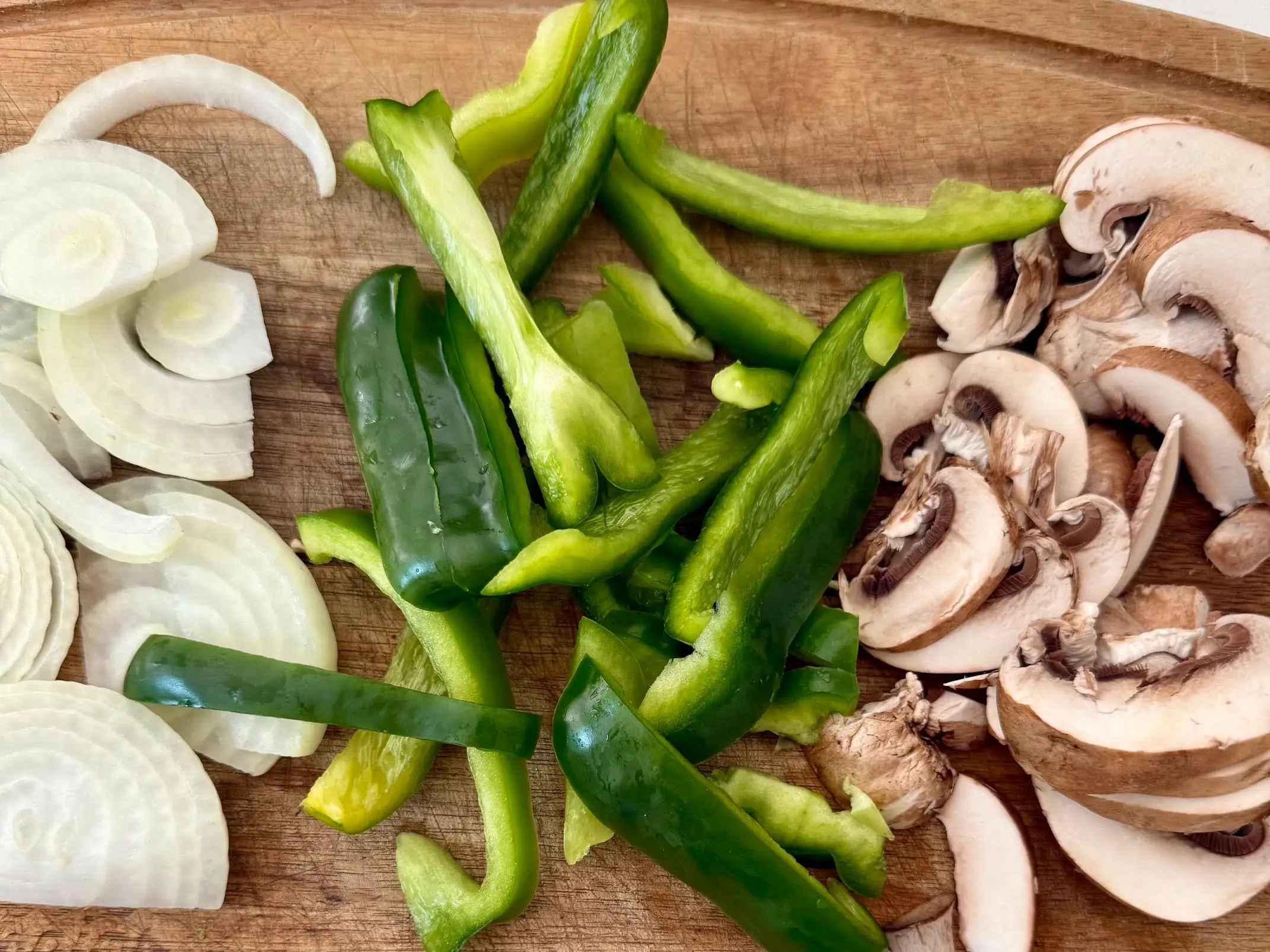Chopped onions, green peppers, and mushrooms.