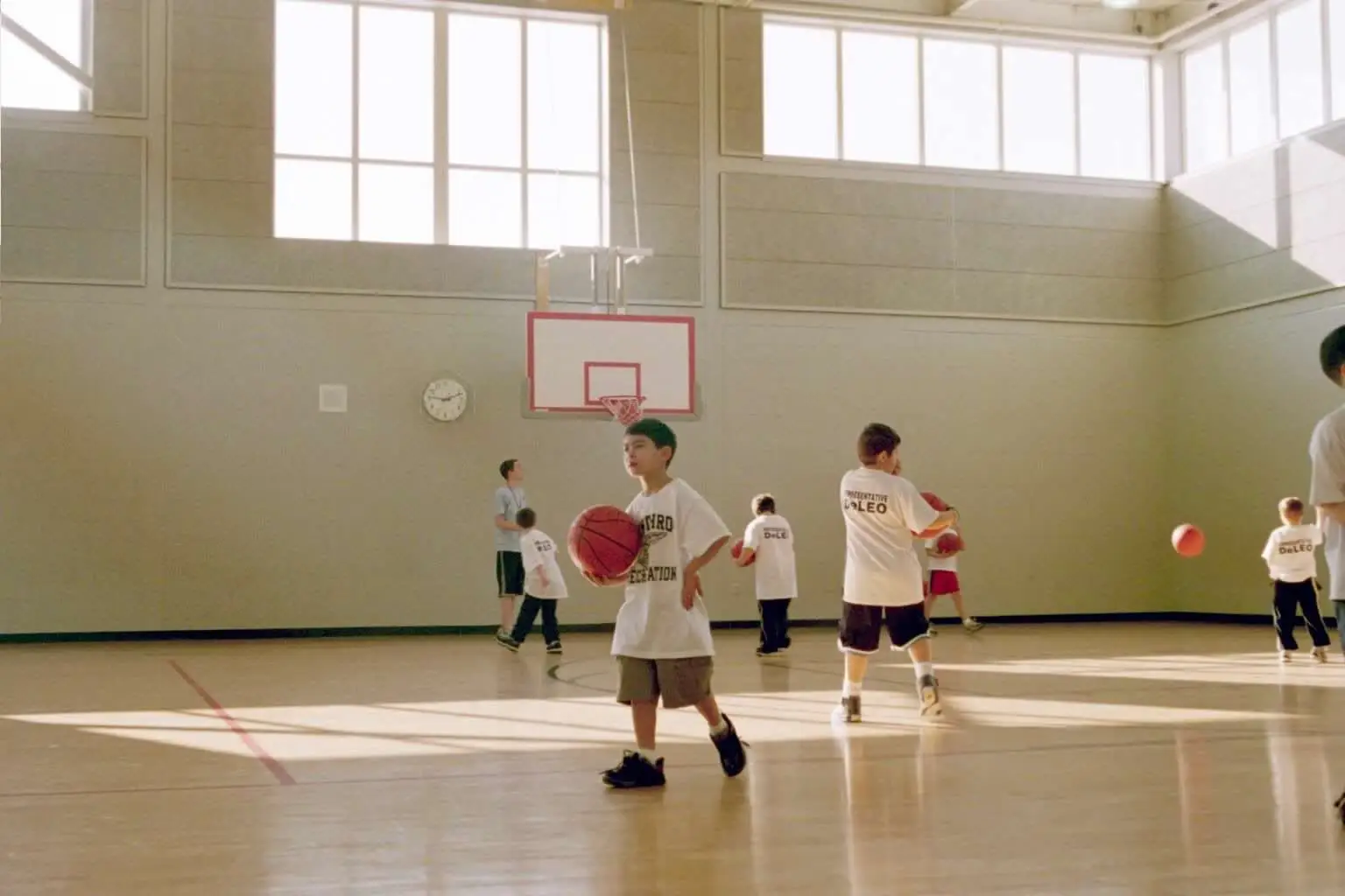 Kids playing basketball at school