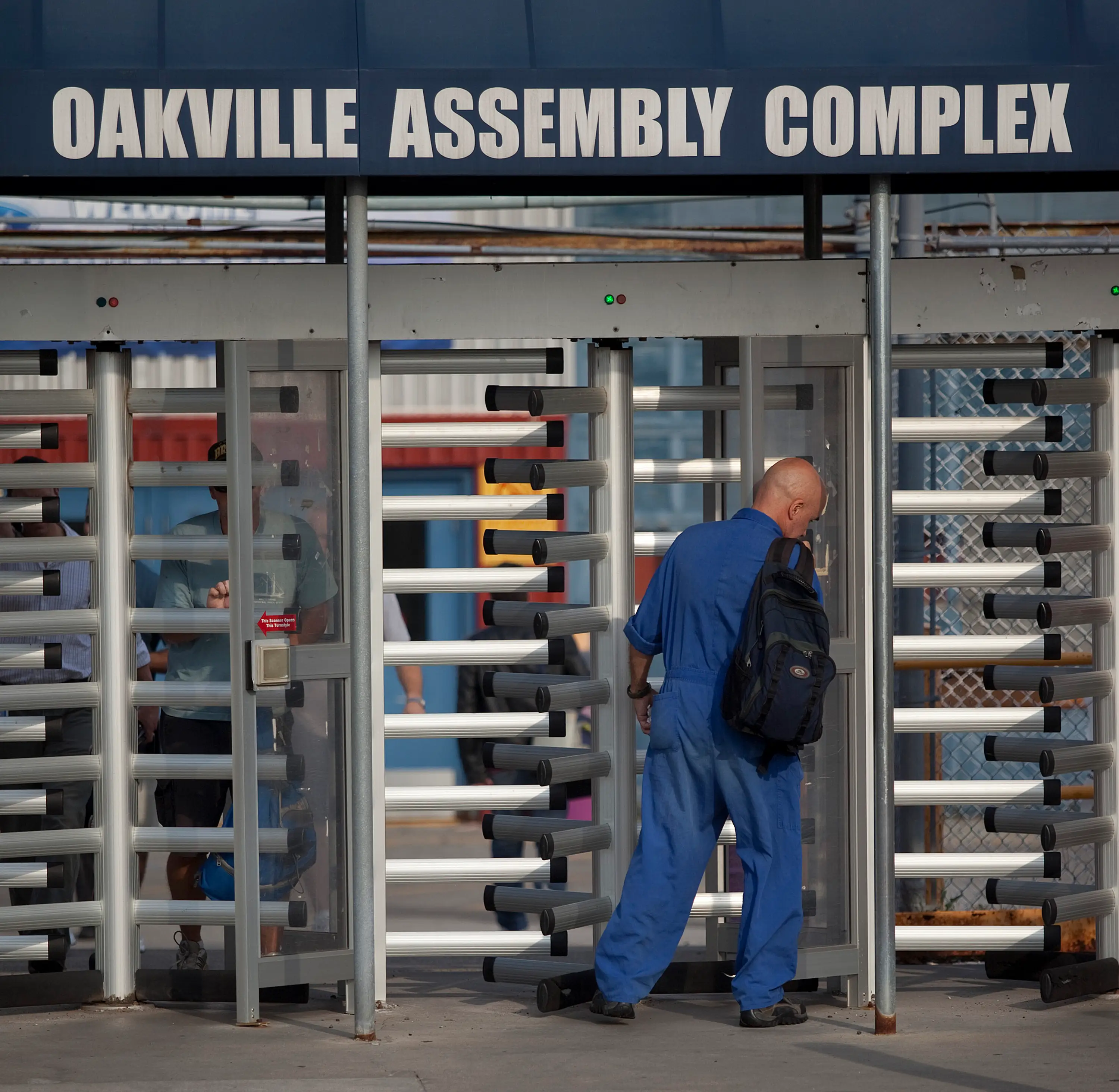 A Ford employee walks into Ford's Oakville assembly plant right outside Toronto.