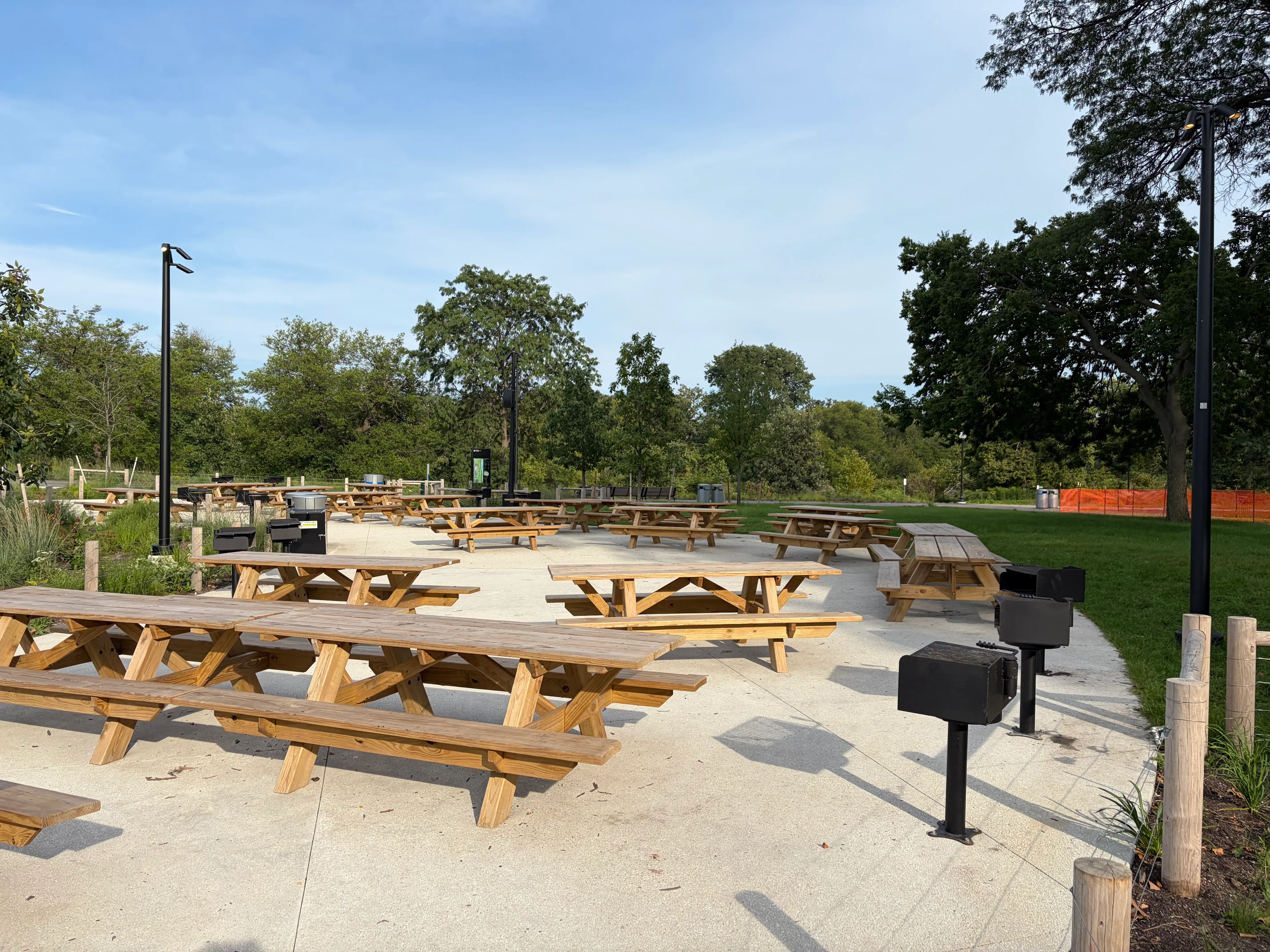 Picnic tables and communal grills at the Obama Presidential Library campus in Chicago.