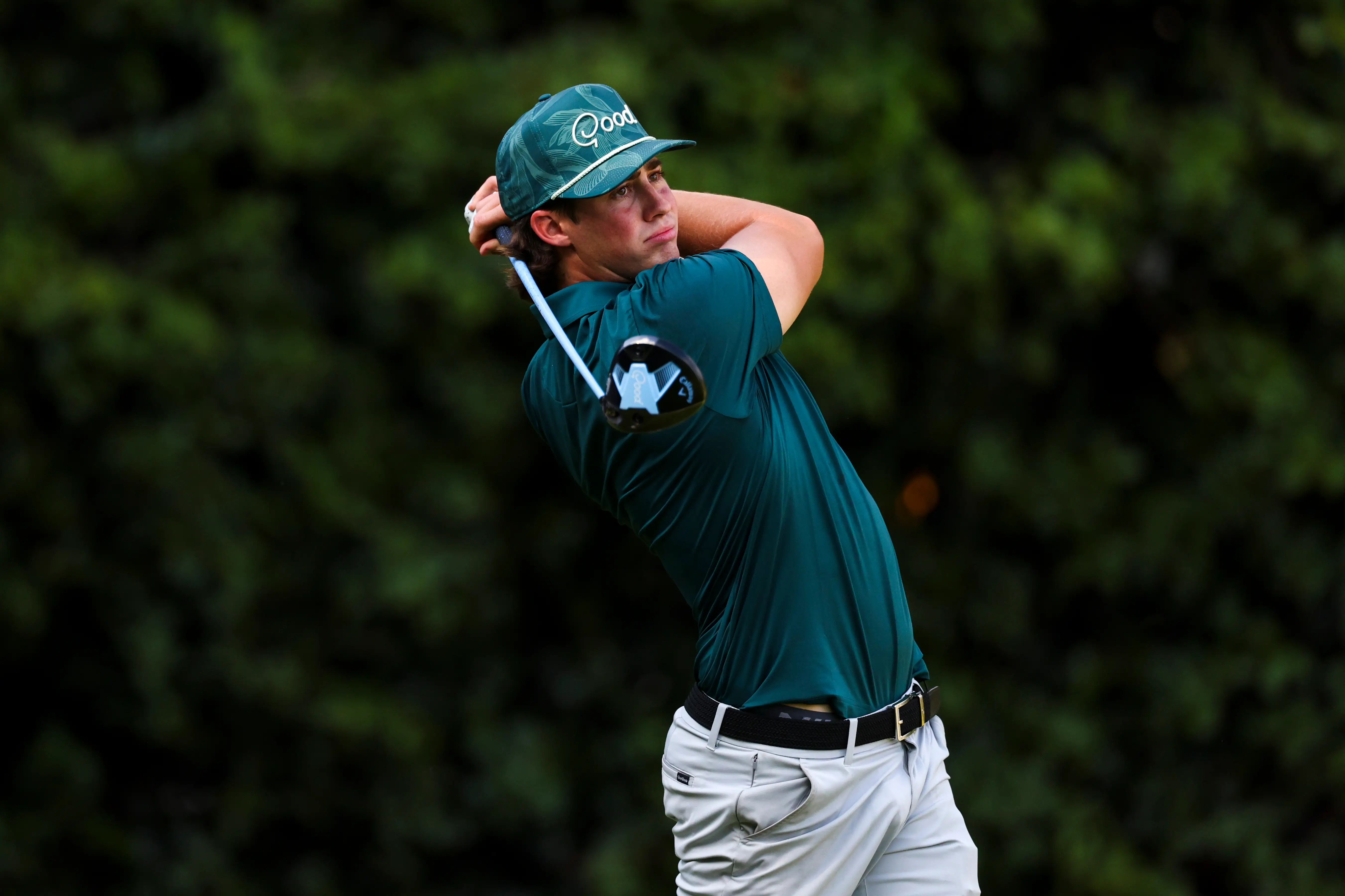Golfer and YouTuber Garrett Clark hits a shot.