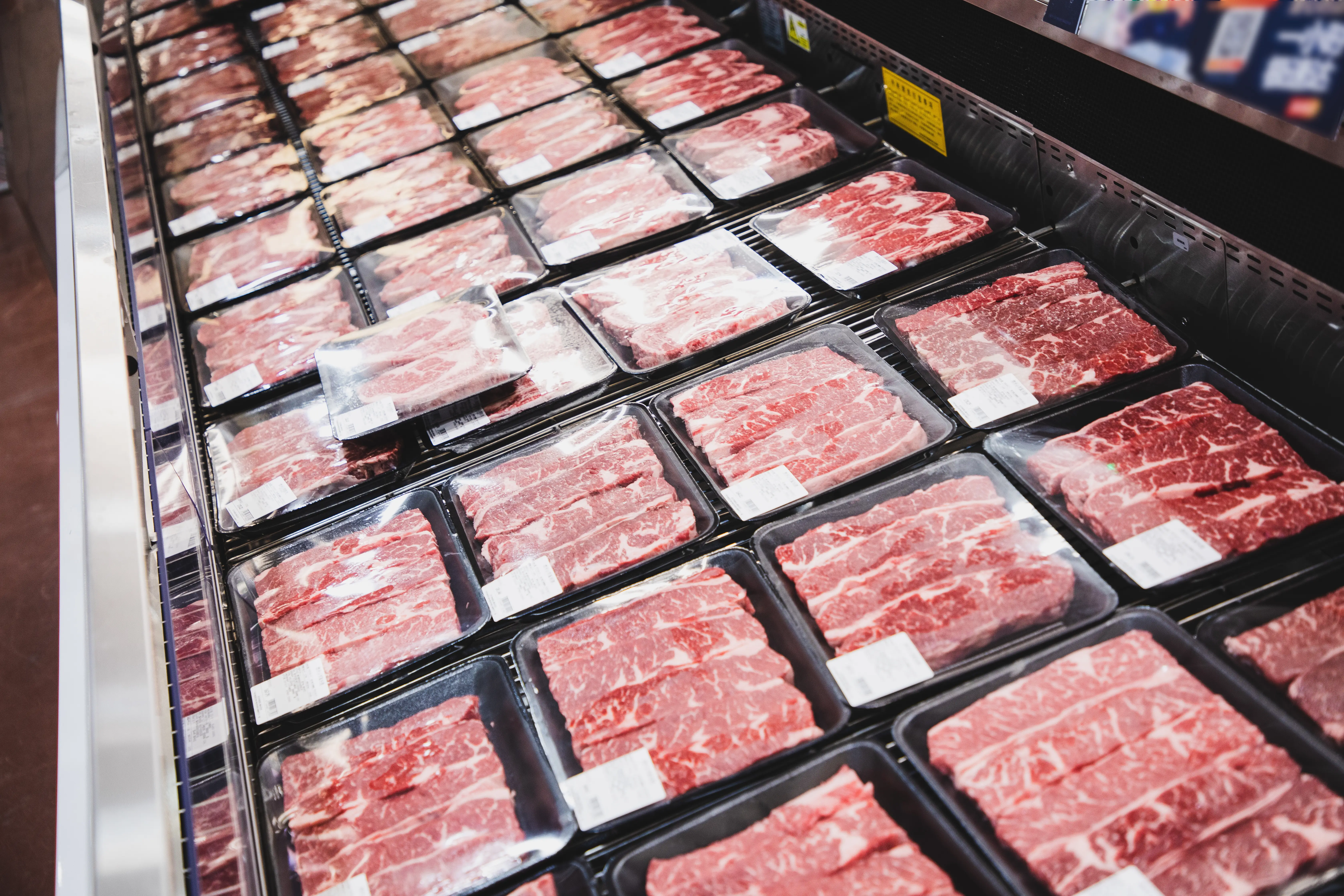 A cooler full of meat is pictured.