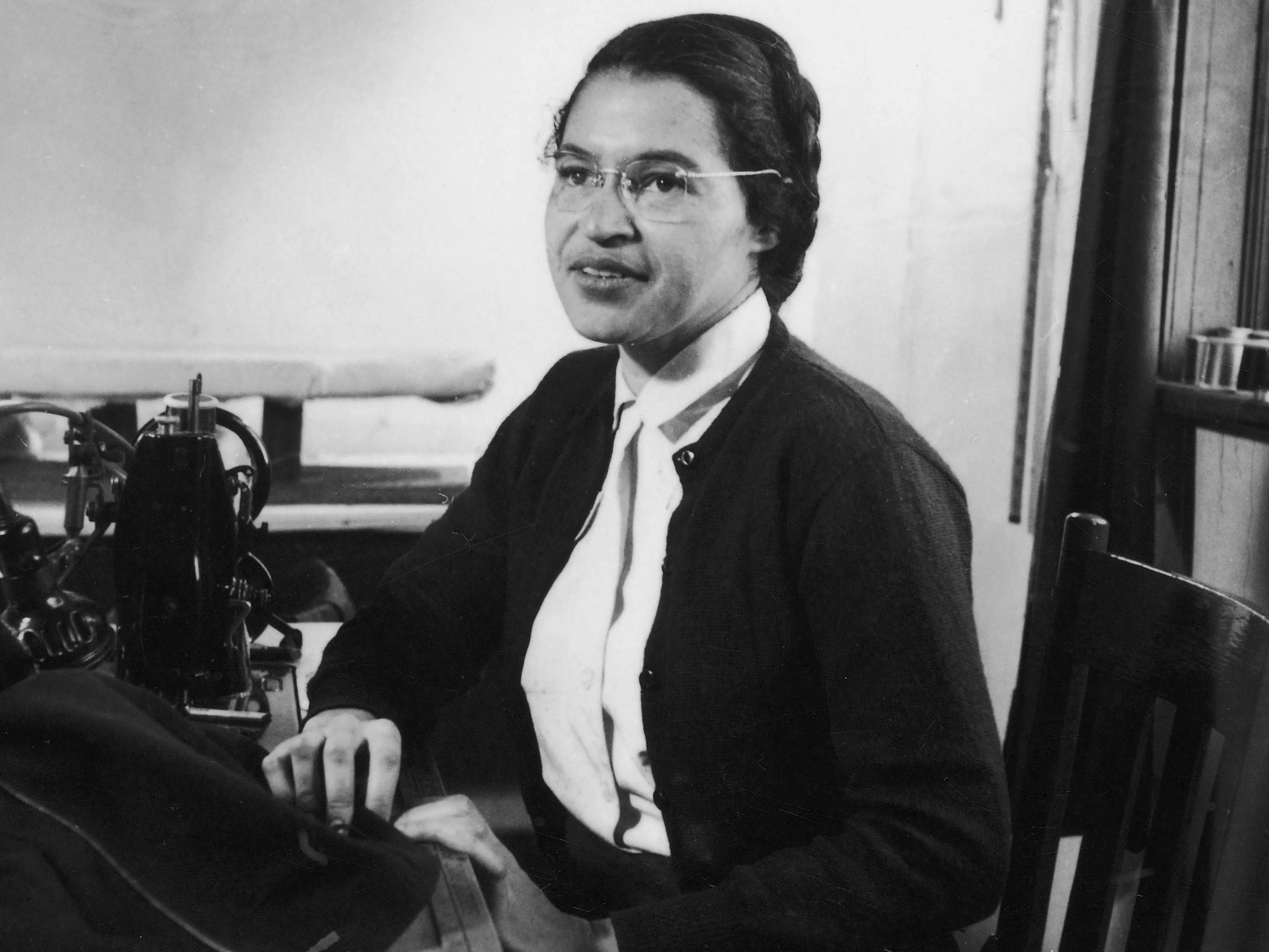 American Civil Rights activist Rosa Parks poses as she works as a seamstress, shortly after the beginning of the Montgomery bus boycott, Montgomery, Alabama, February 1956.