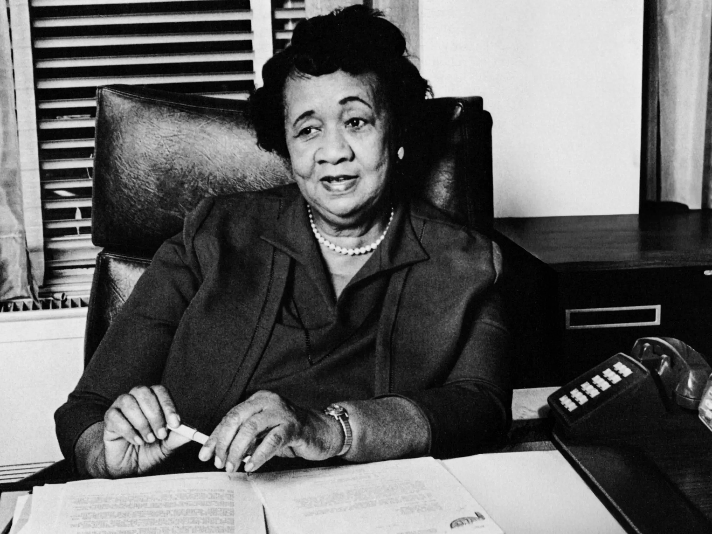 Portrait of American Civil Rights & women's rights activist Dorothy Irene Height (1912 - 2010) seated at a desk, Washington DC, 1978 or 1979.