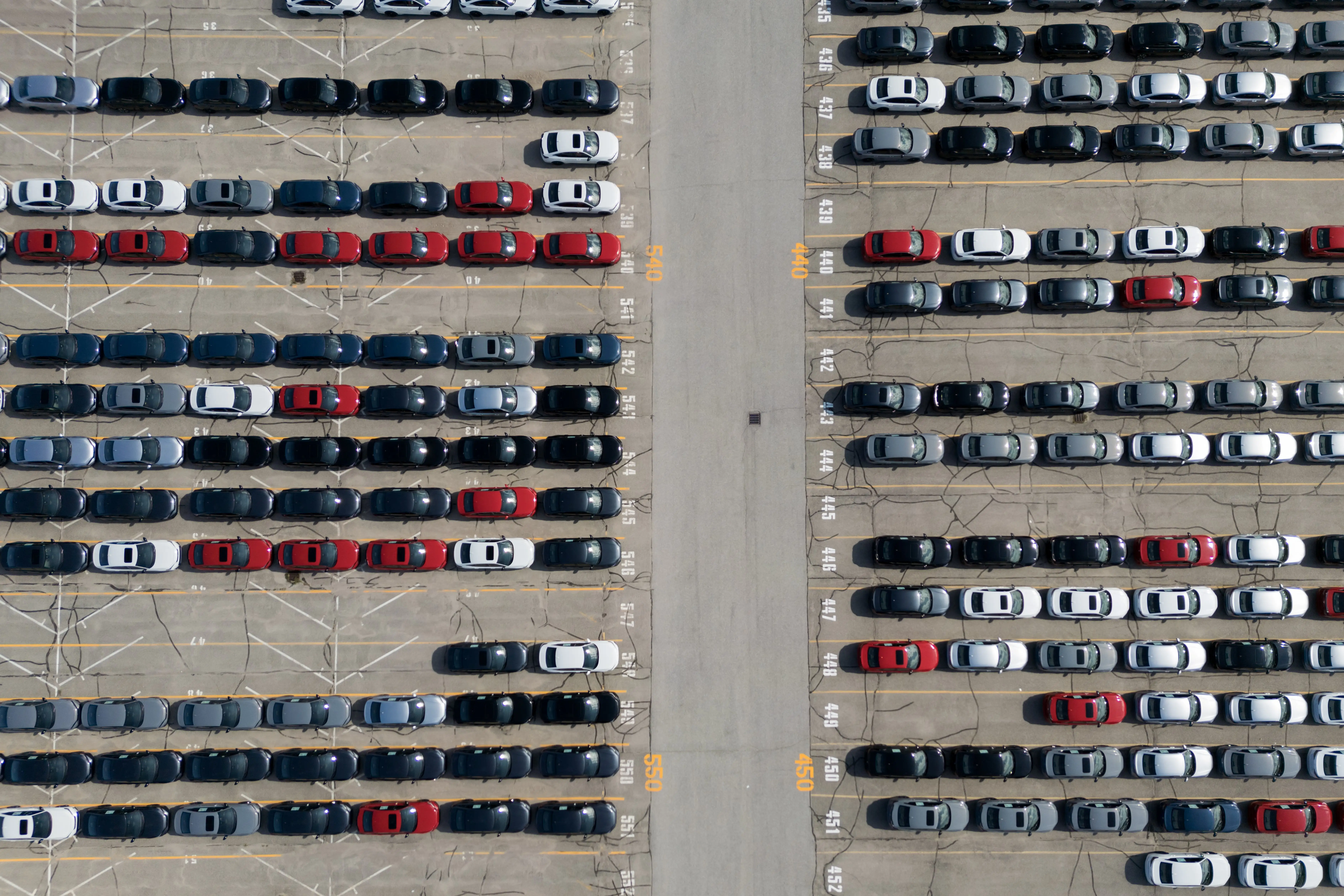 Rows of newly-assembled Honda vehicles are parked outside the Alliston, Ontario, plant.
