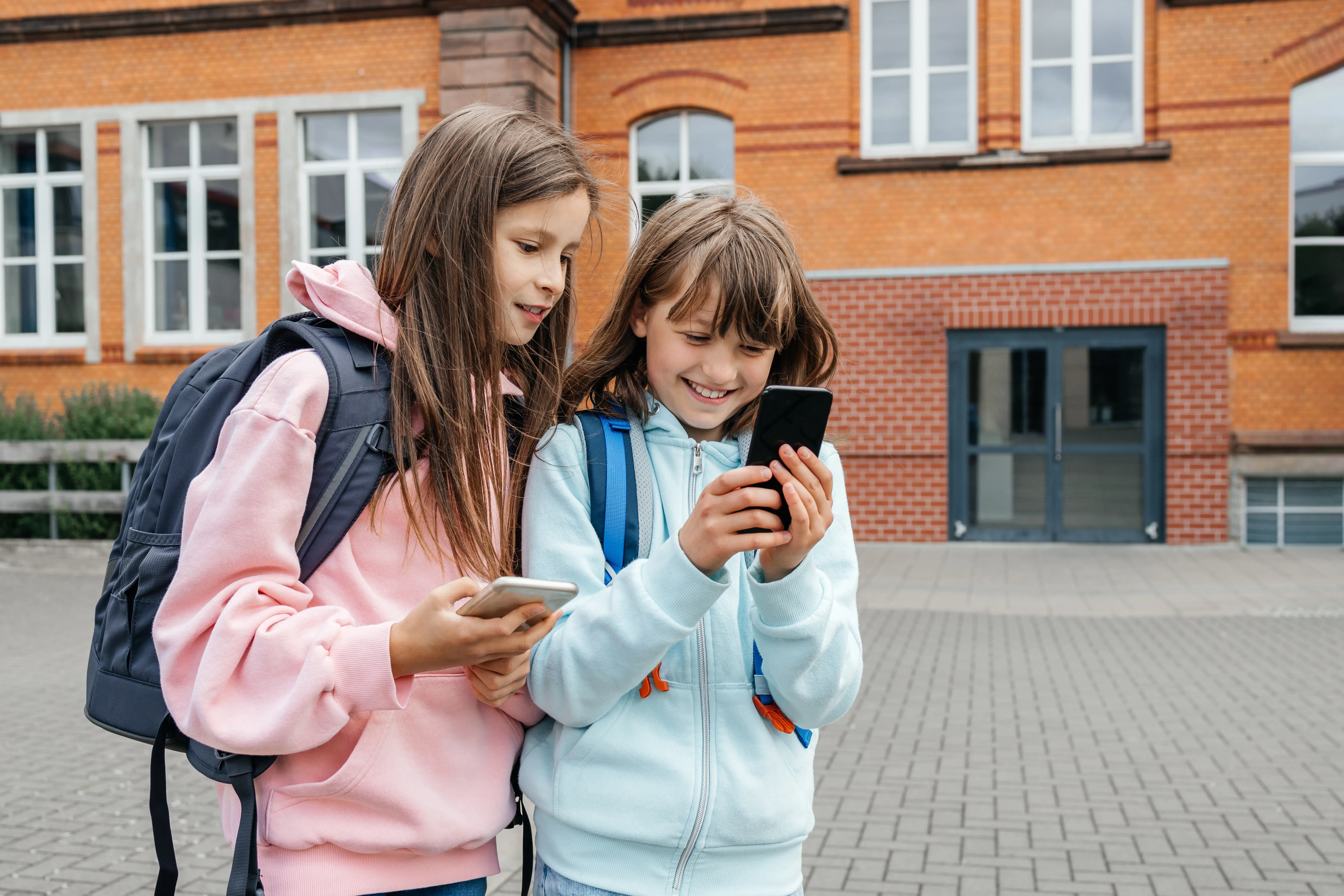 two girls on a phone