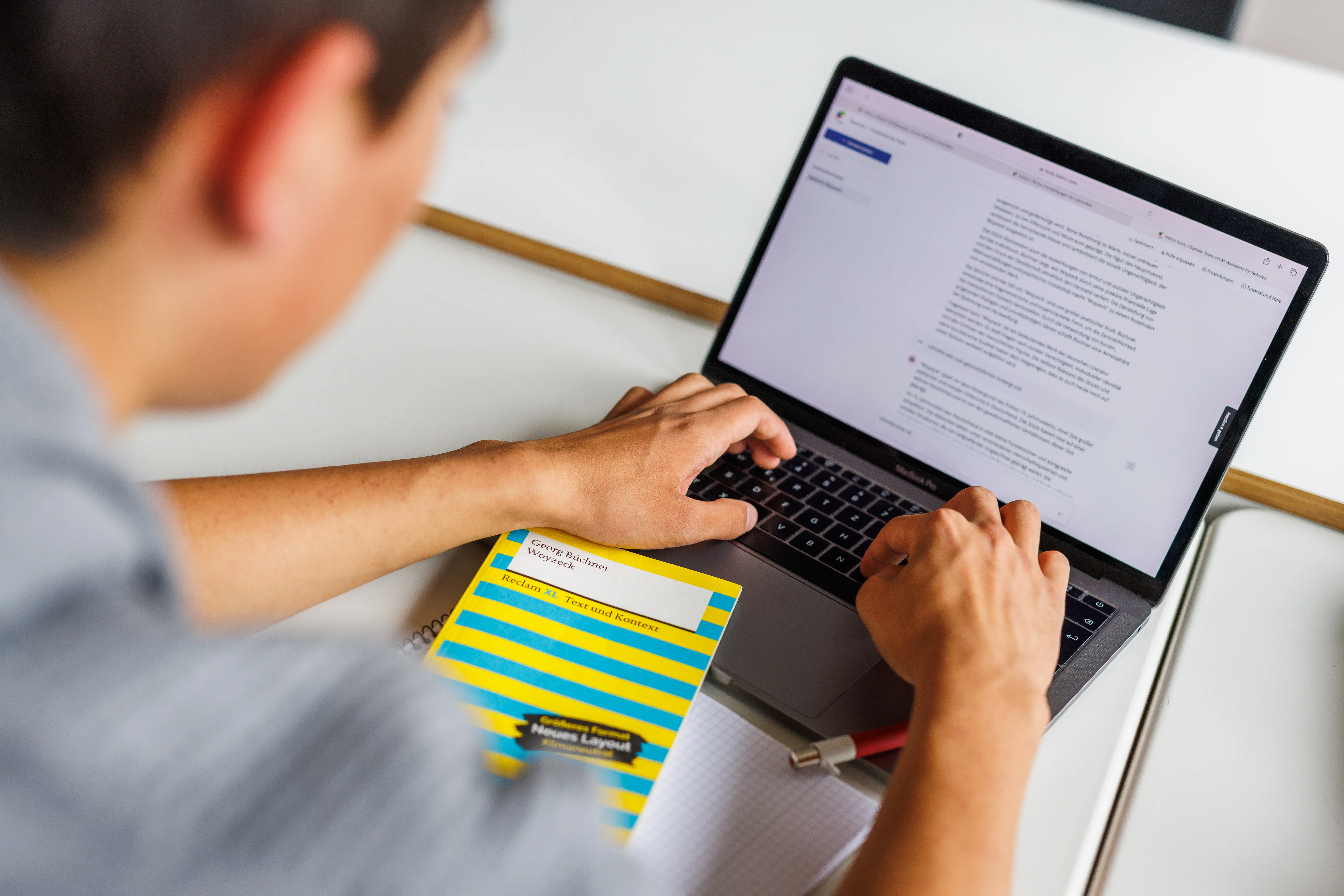 A student uses an AI tool on a laptop.